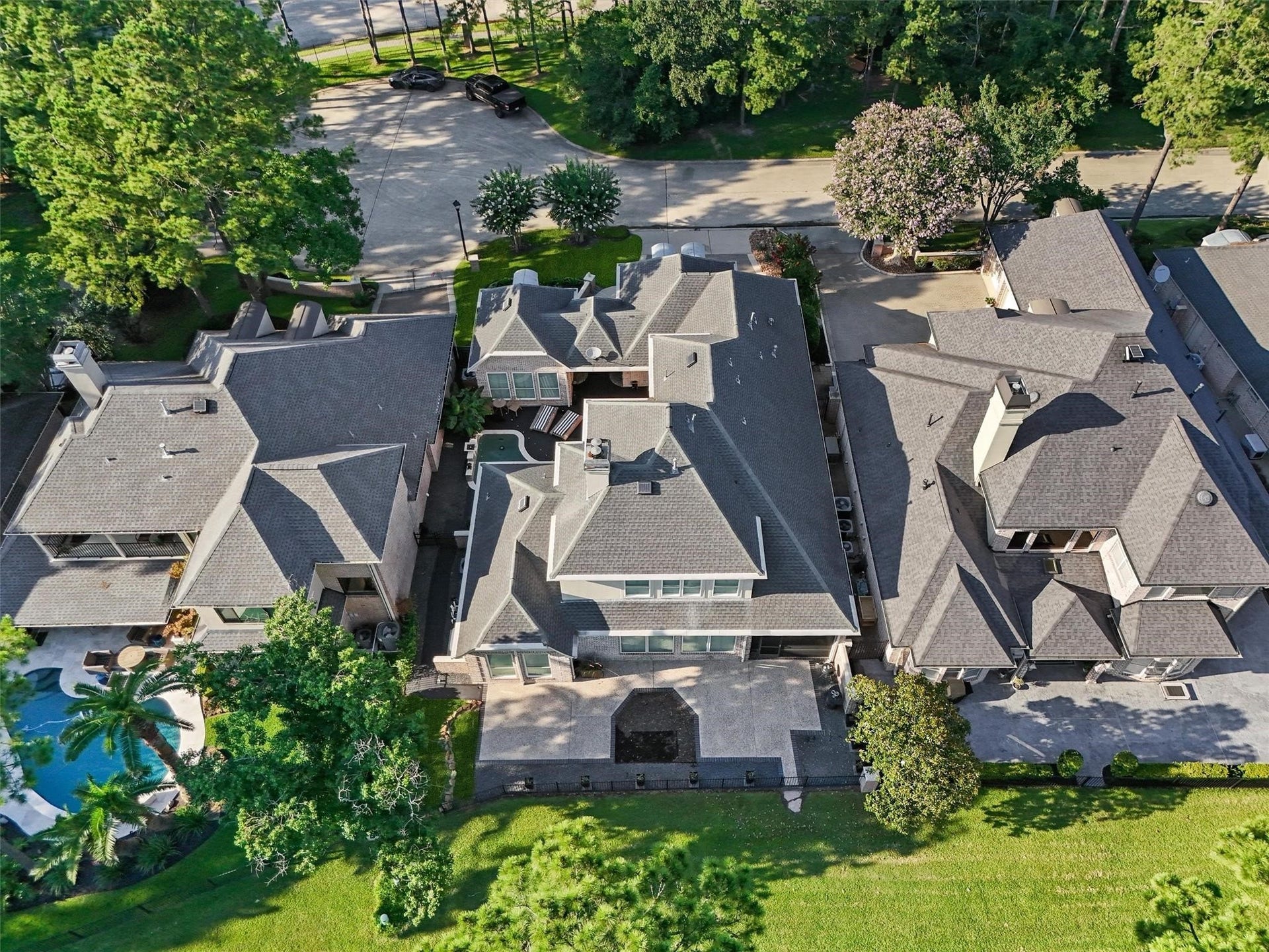 Aerial view of home, pool and golf course lot