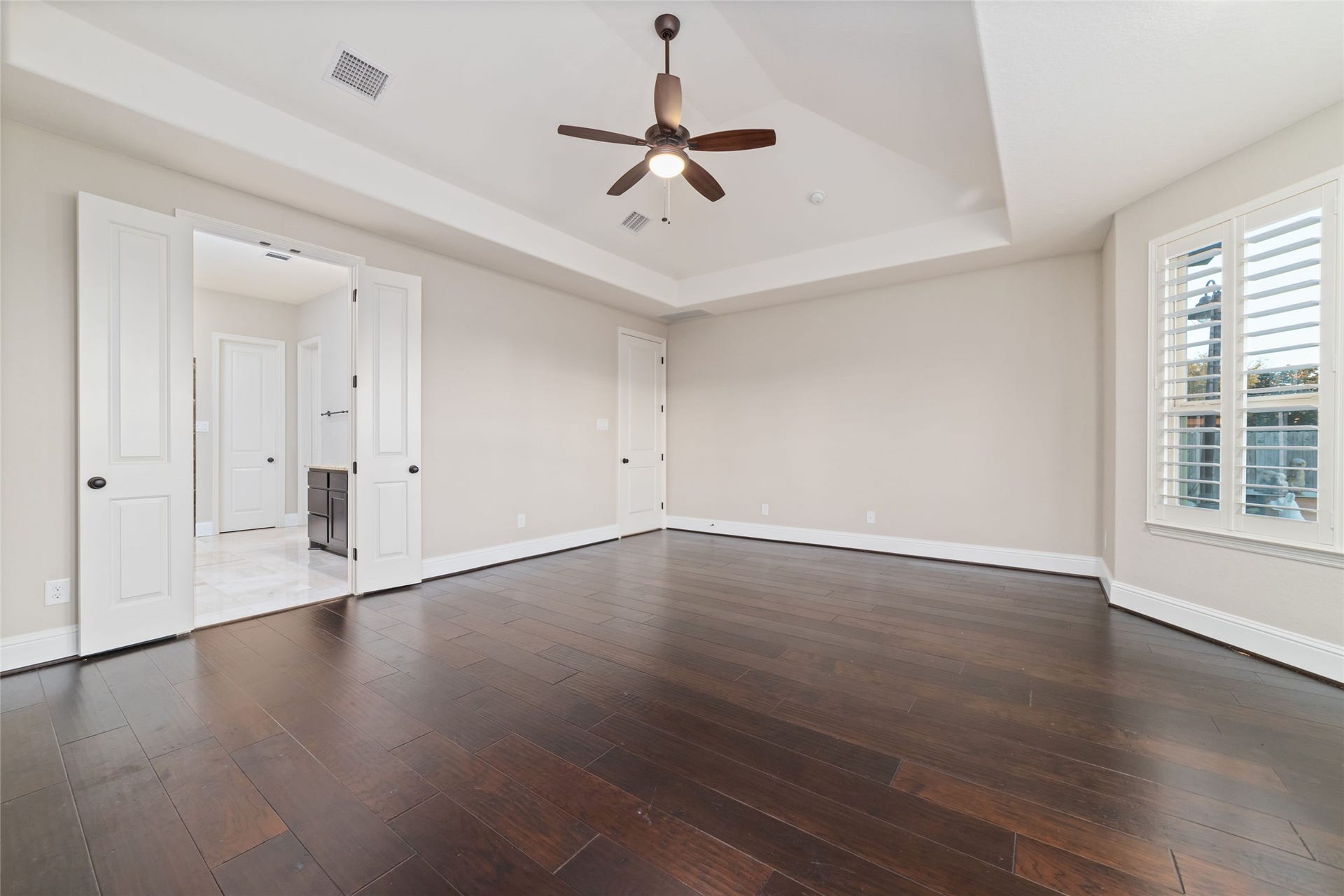 another view of the primary bedroom