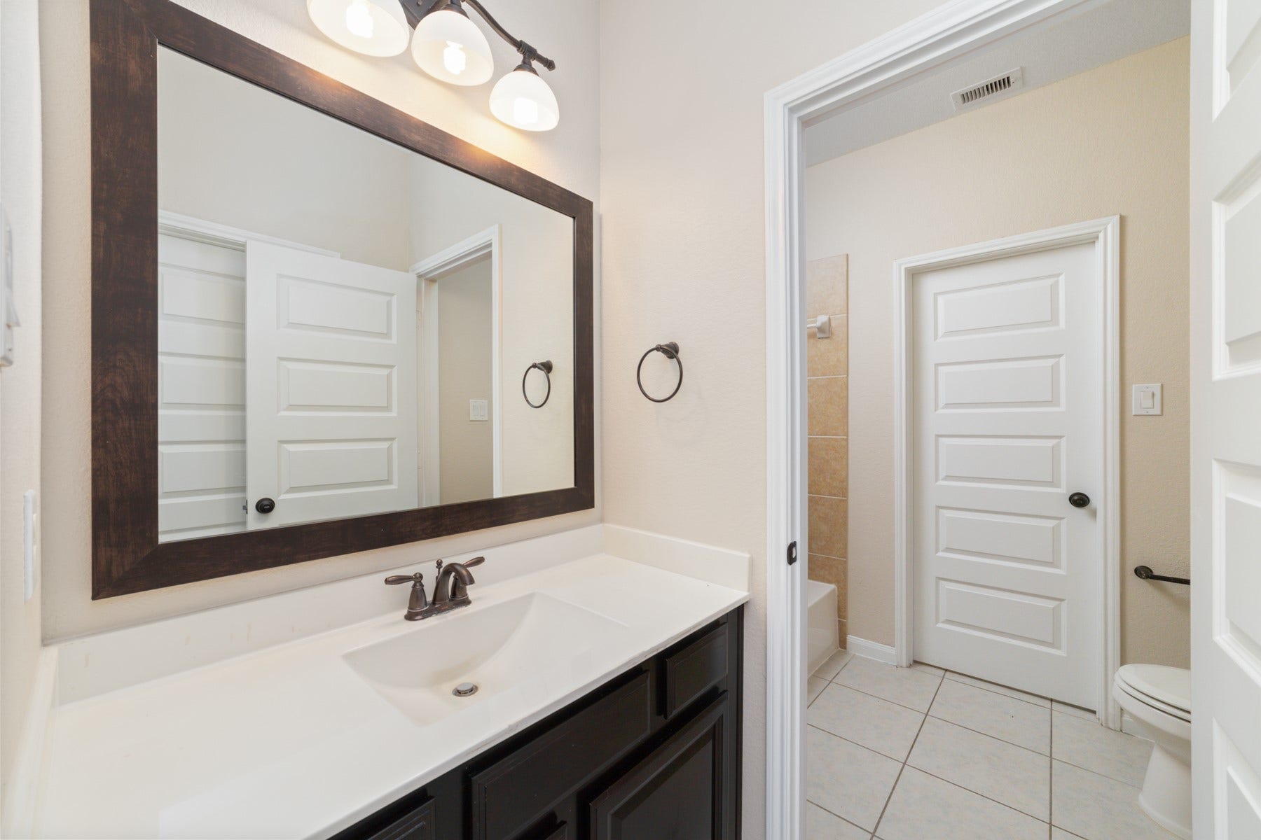 17302 Milrig Court, Richmond, TX 77407 Bathroom #4 - Upstairs, the Jack and Jill bathroom offers convenience and style with its sleek design and shared access, perfect for family living.