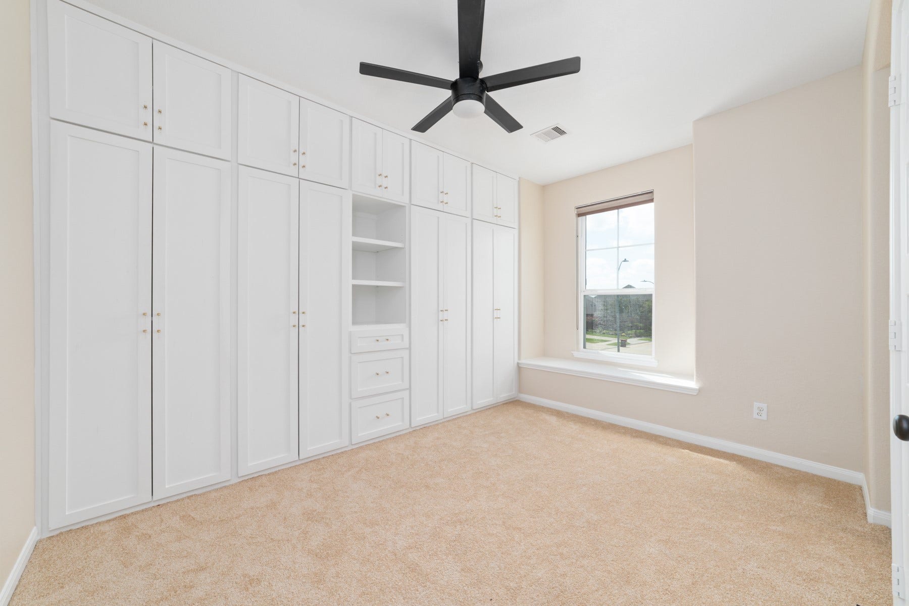 17302 Milrig Court, Richmond, TX 77407 Bedroom #5 - Discover an oversized bedroom featuring elegant built-in cabinets, offering abundant storage and style.