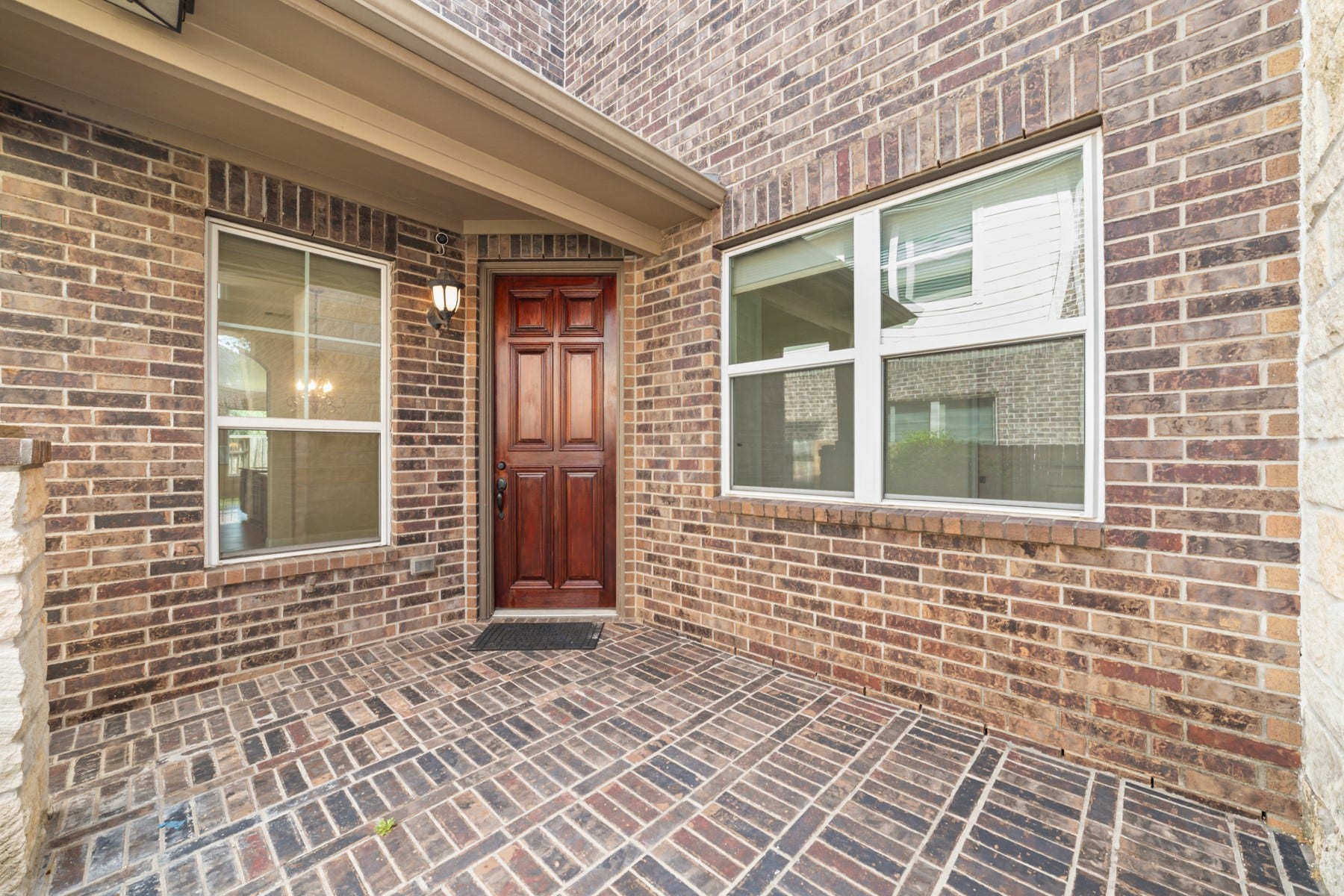 17302 Milrig Court, Richmond, TX 77407 Experience peace of mind in this inviting space, featuring a private patio with a stylish iron gate that provides safety.