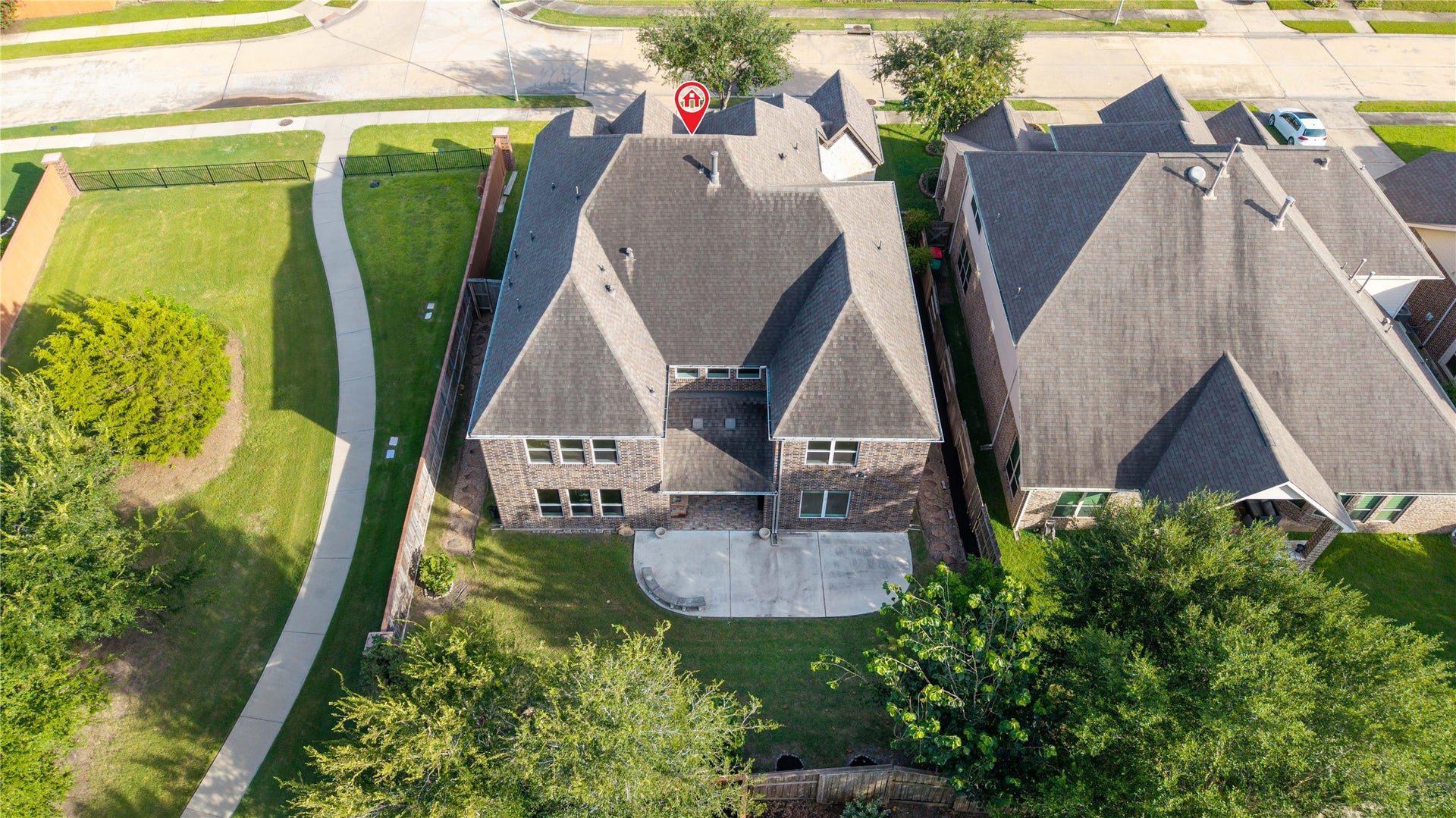17302 Milrig Court, Richmond, TX 77407 Spacious two-story home with a large, private backyard and patio, perfect for outdoor activities and entertaining.