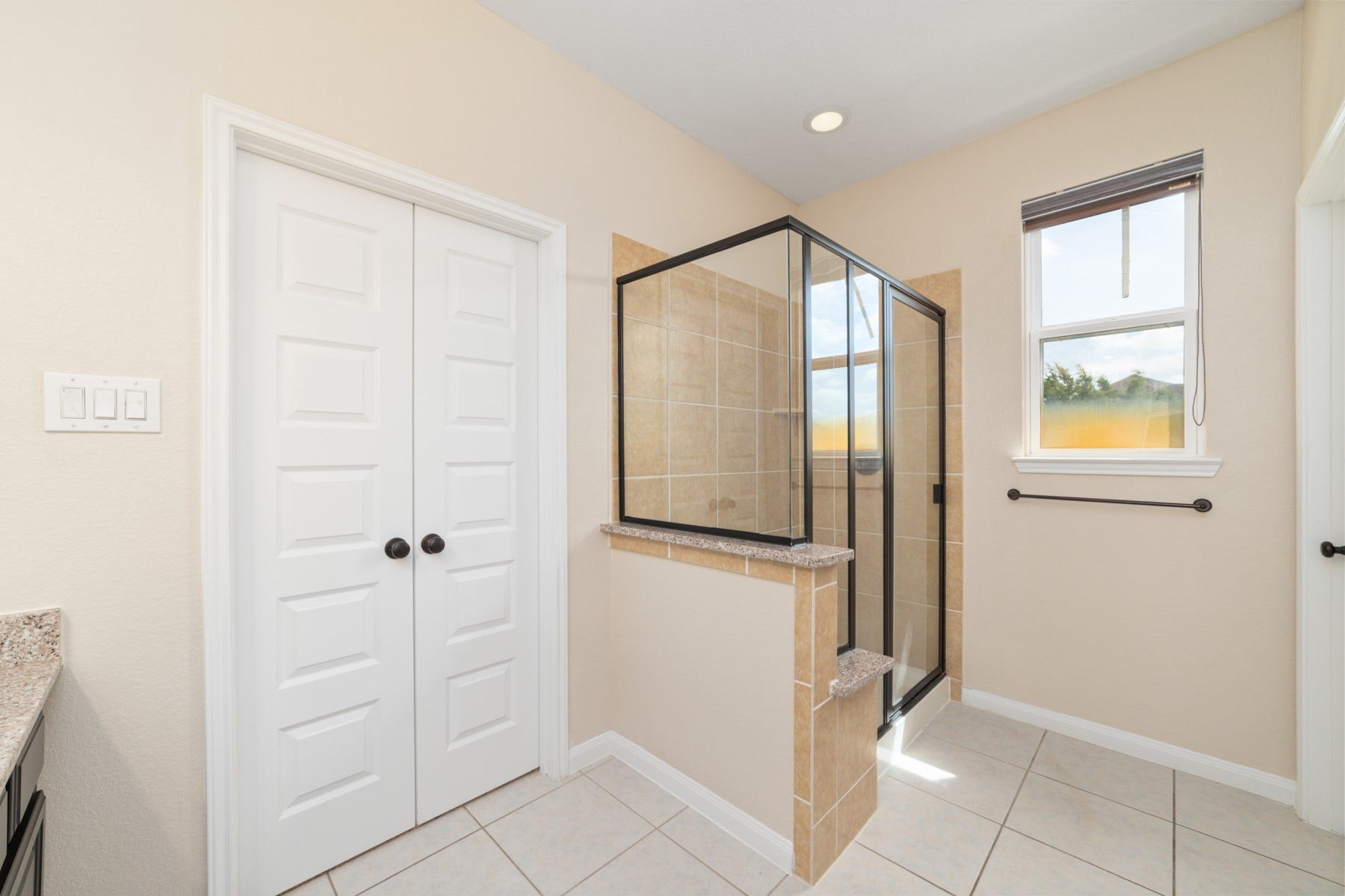 17302 Milrig Court, Richmond, TX 77407 Bathroom #5 - Offers a bright, spacious retreat with sleek tile flooring and a modern glass-enclosed shower.