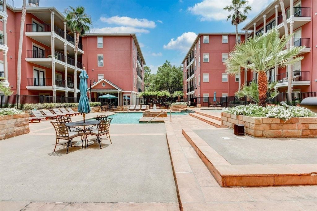 2400 S Mccue Road, #104, Houston, TX 77056 View of pool with pleanty of seating to enjoy the sun and entertaining friends.