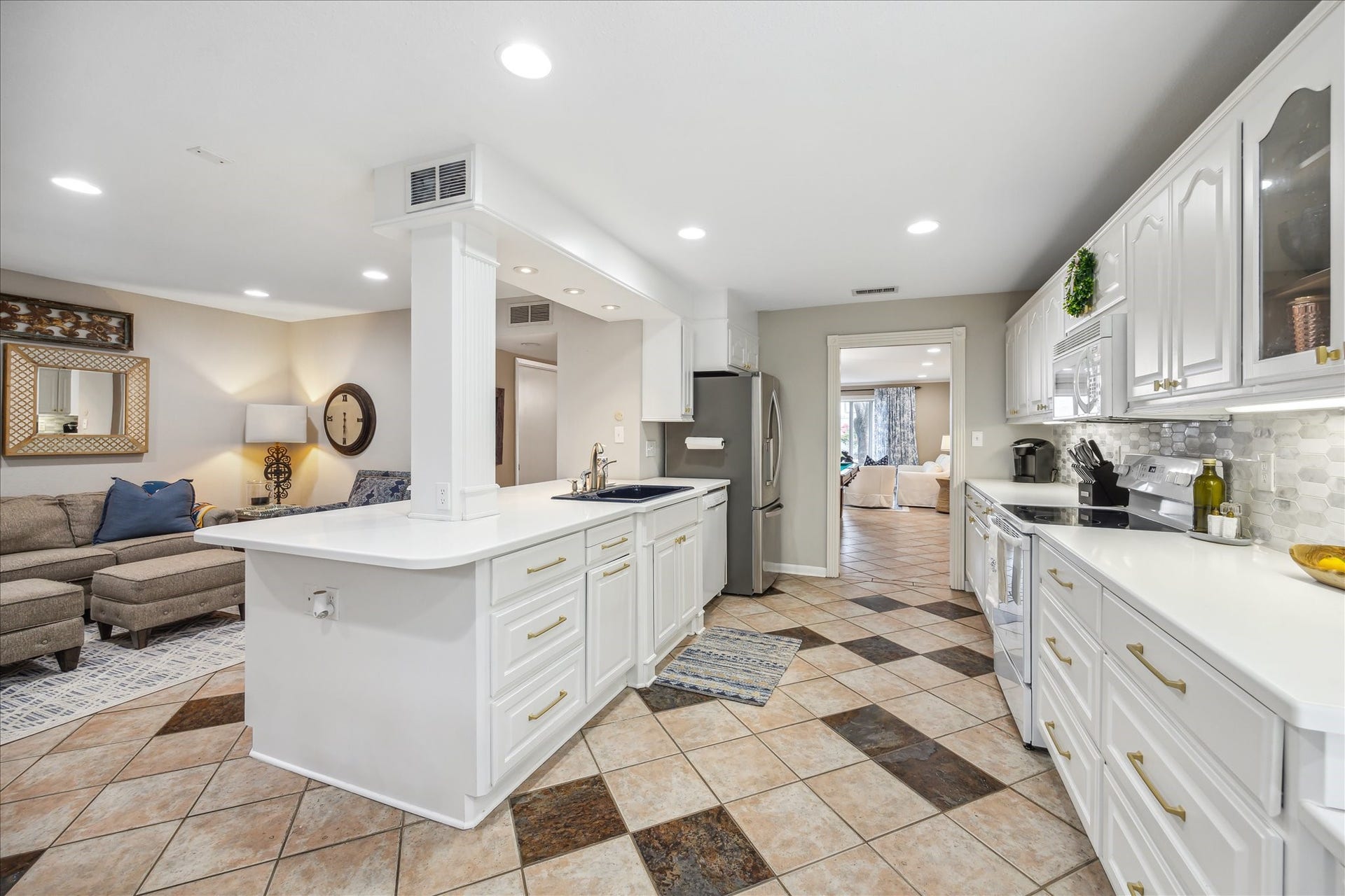 Cooks kitchen with stylish backsplash, island, great storage and counter space!
