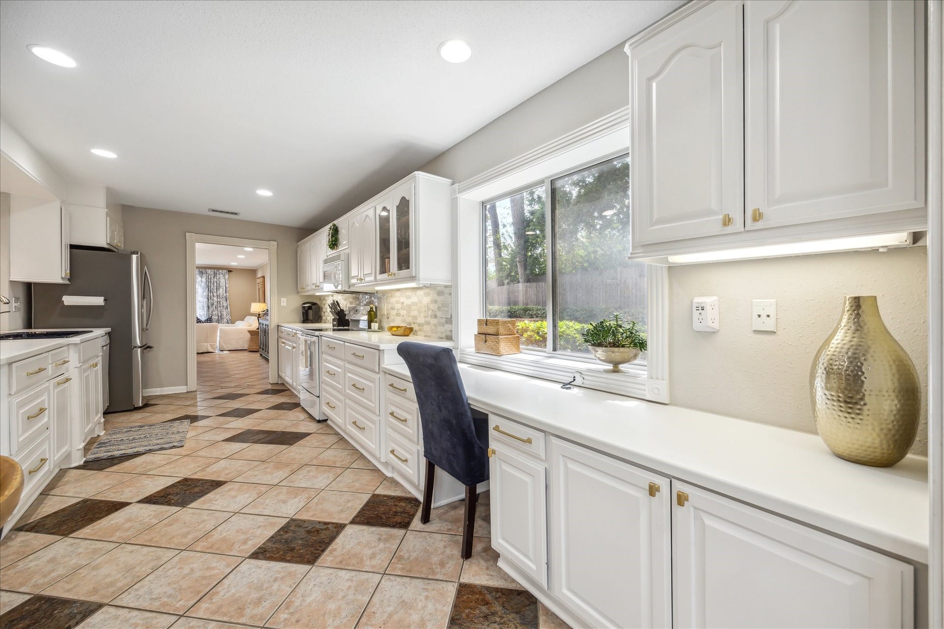 Large desk at the kitchen with window.