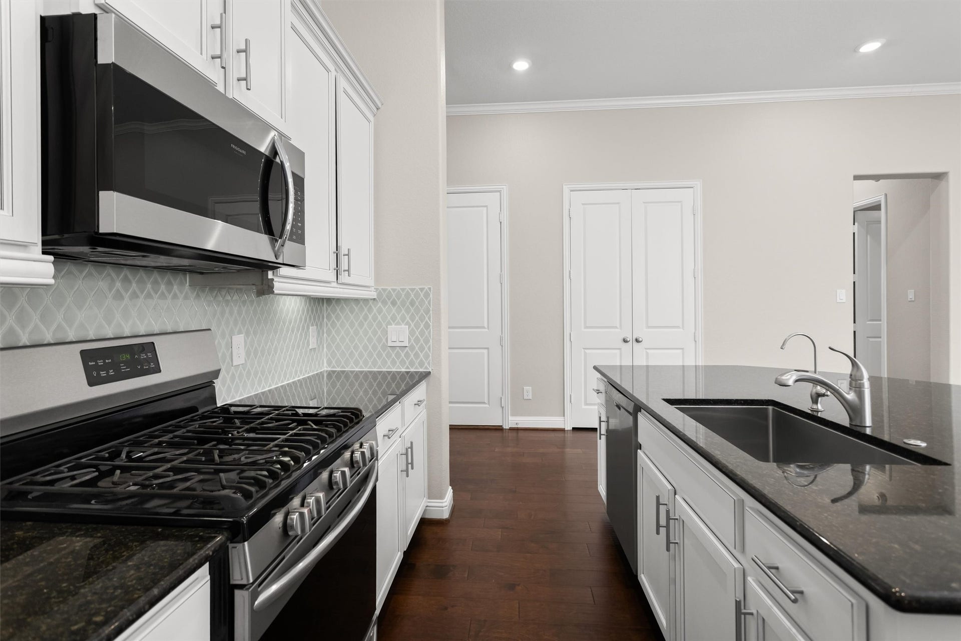 28205 Bennett Pass Drive, Spring, TX 77386 Black and stainless appliances. Gas range.