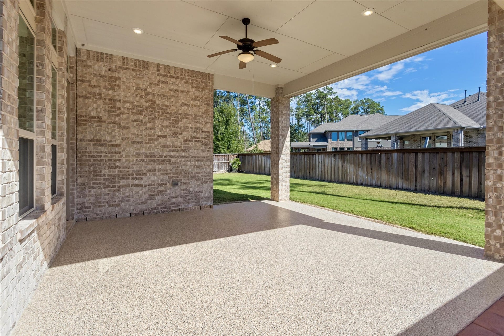 28205 Bennett Pass Drive, Spring, TX 77386 Extended and covered back patio with epoxy floor.