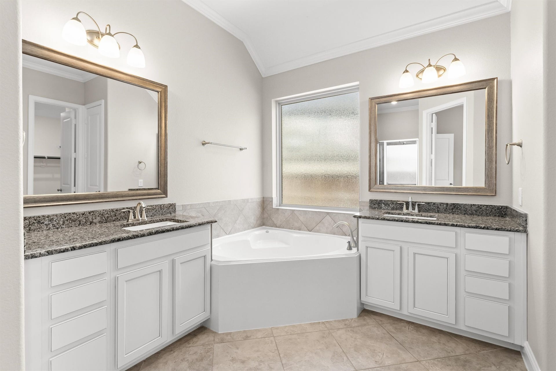 28205 Bennett Pass Drive, Spring, TX 77386 Primary bathroom with double vanities and corner soaking tub