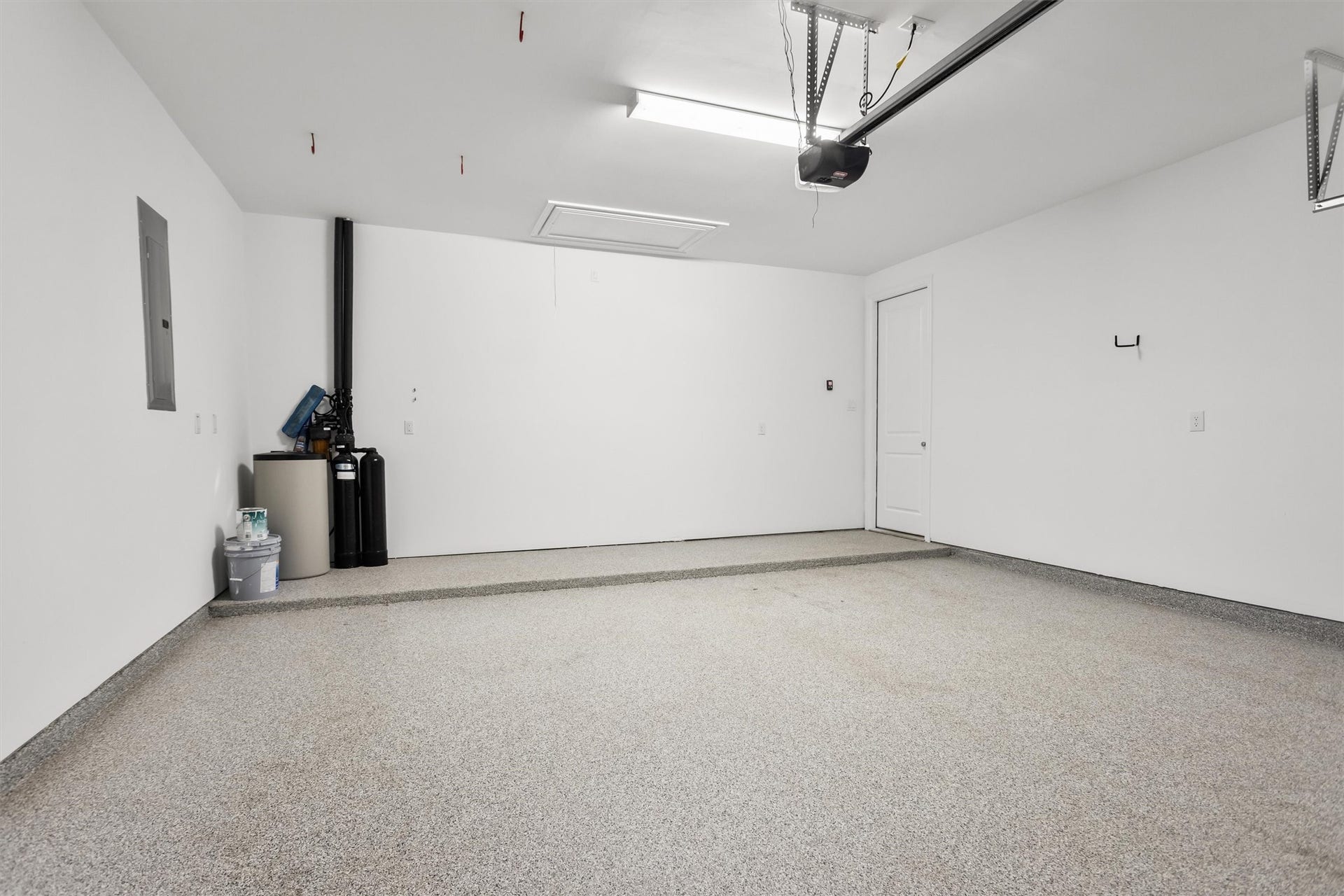 28205 Bennett Pass Drive, Spring, TX 77386 Attached 2 car garage with upgraded epoxy floors. The whole home water softener is included.