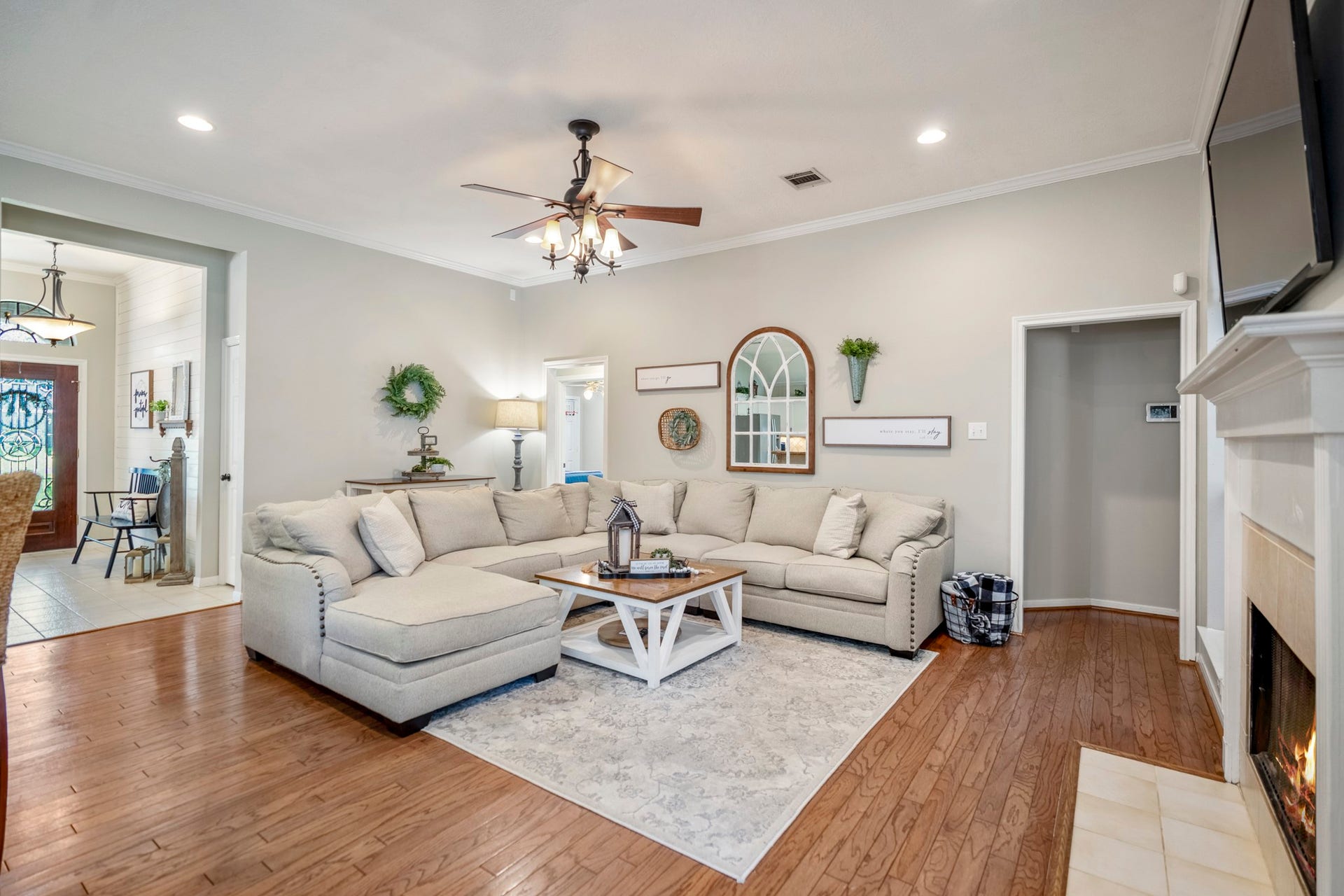 812 Woodland Lane, Conroe, TX 77302 This home features a split floorplan, with the primary suite tucked at the back of the home and three secondary bedrooms down a separate hall.
