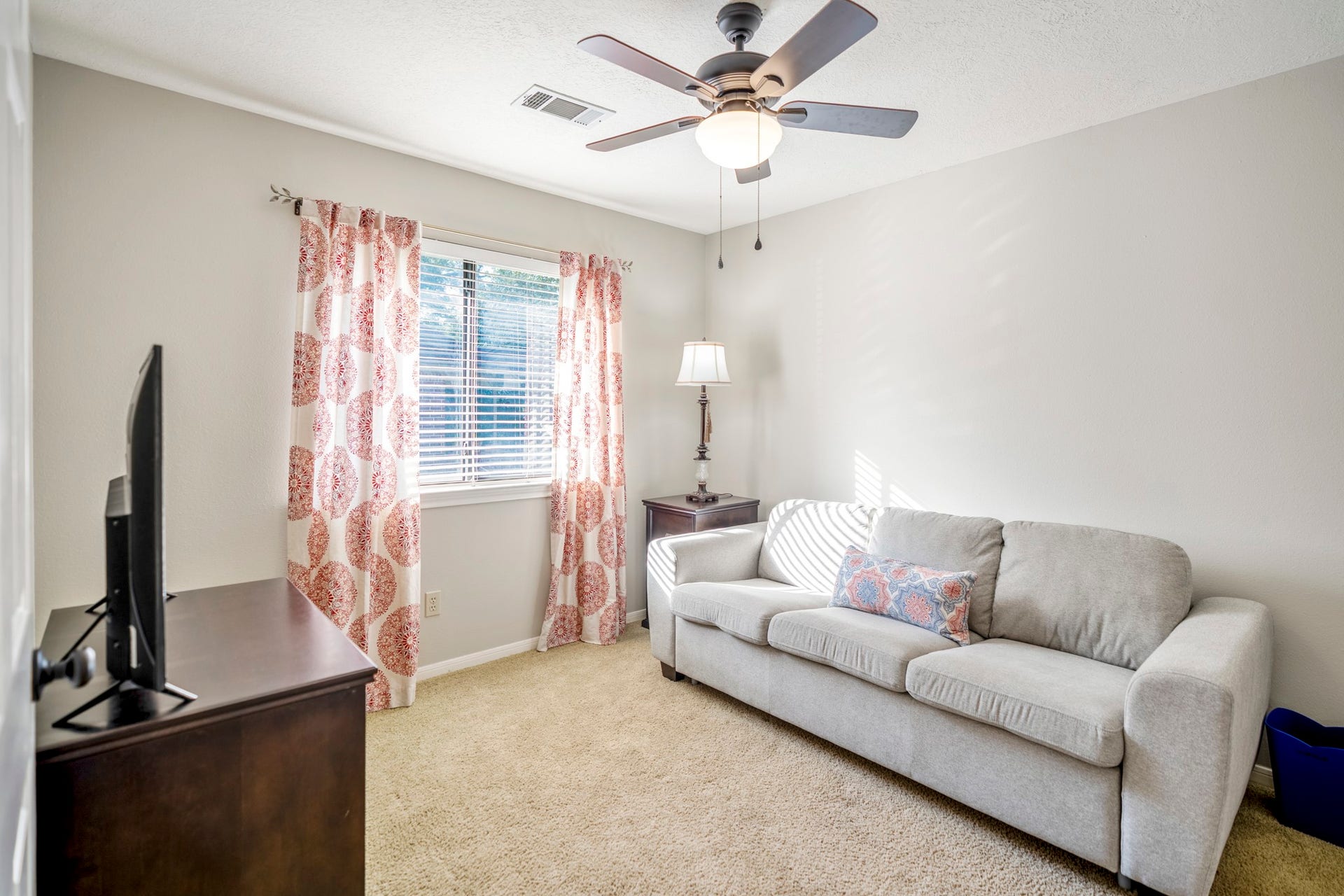 812 Woodland Lane, Conroe, TX 77302 Comfortable secondary bedroom with neutral paint, natural light and plenty of room to make it your own.