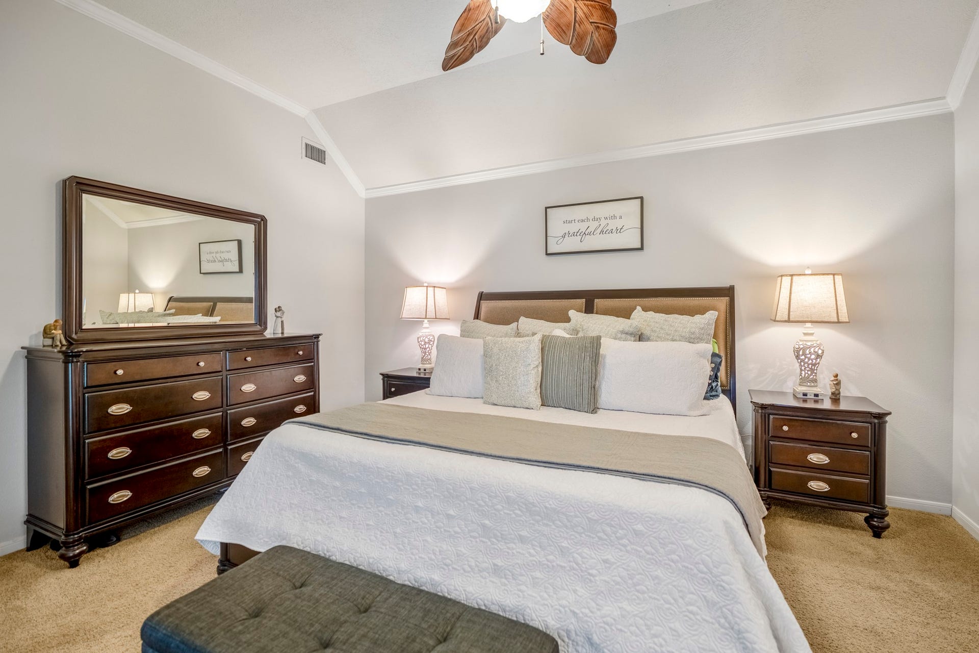 812 Woodland Lane, Conroe, TX 77302 Generously sized primary bedroom with high ceilings and plenty of space for large furnishings.
