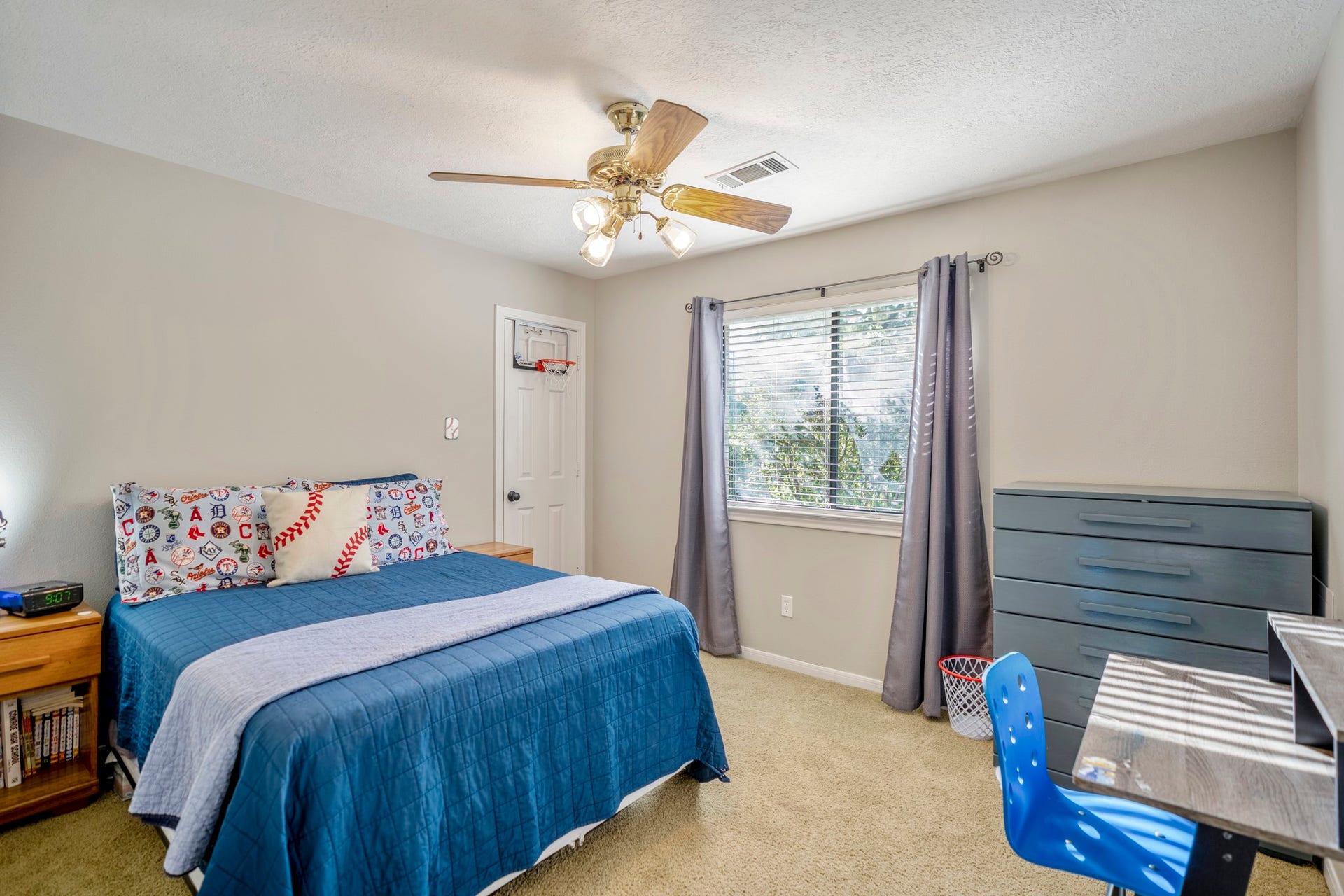 812 Woodland Lane, Conroe, TX 77302 Another secondary bedroom featuring a walk in closet, offers flexible space for kids, guests or a home office.