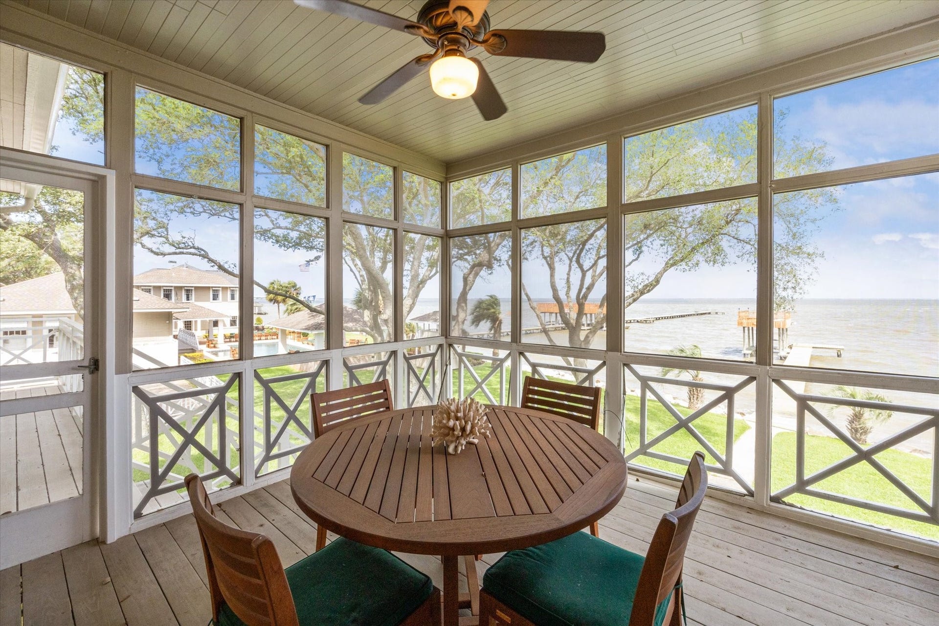 Screened in porch and casual dining area in secondary residence.