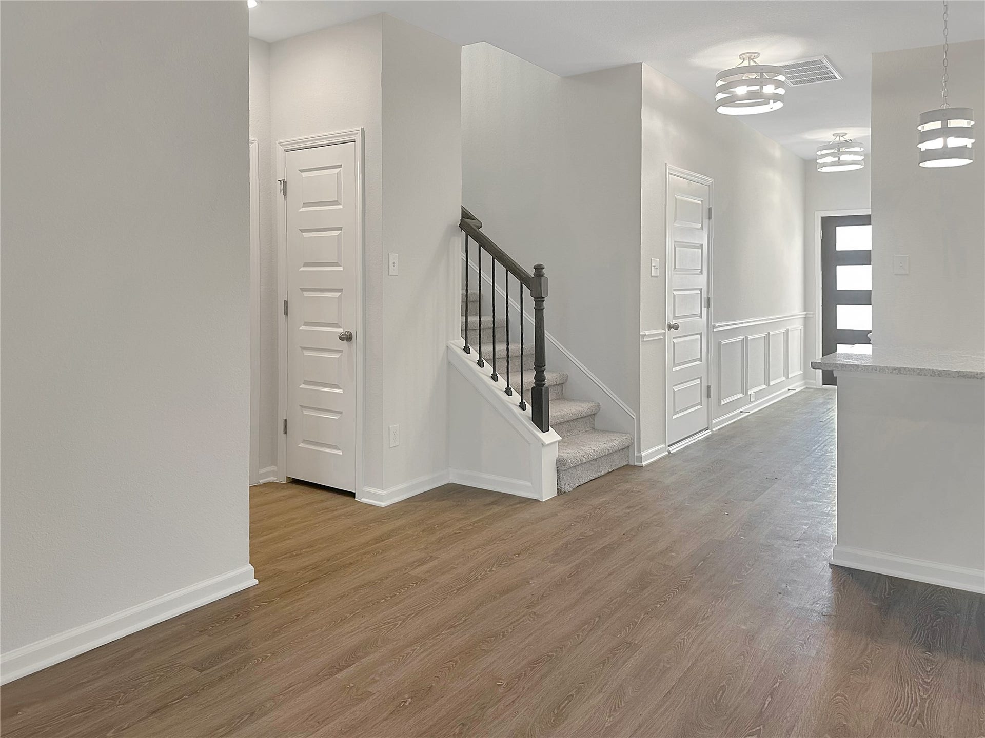 The Caldwell- Family Room and Foyer. Home is under construction. Sample image for illustration; upgrades, options, and colors may vary.