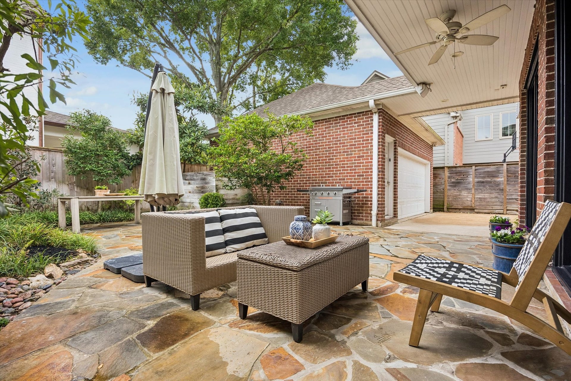 3111 Carnegie Street, Houston, TX 77005 Enjoy this backyard & patio...a grill and tv convey with home. This lovely area is low maintenance and turn-key.