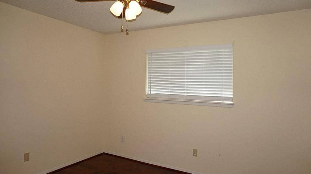 9217 Carousel Lane, Houston, TX 77080 3rd Bedroom, new ceiling fan, new wood blinds, new laminate floor.