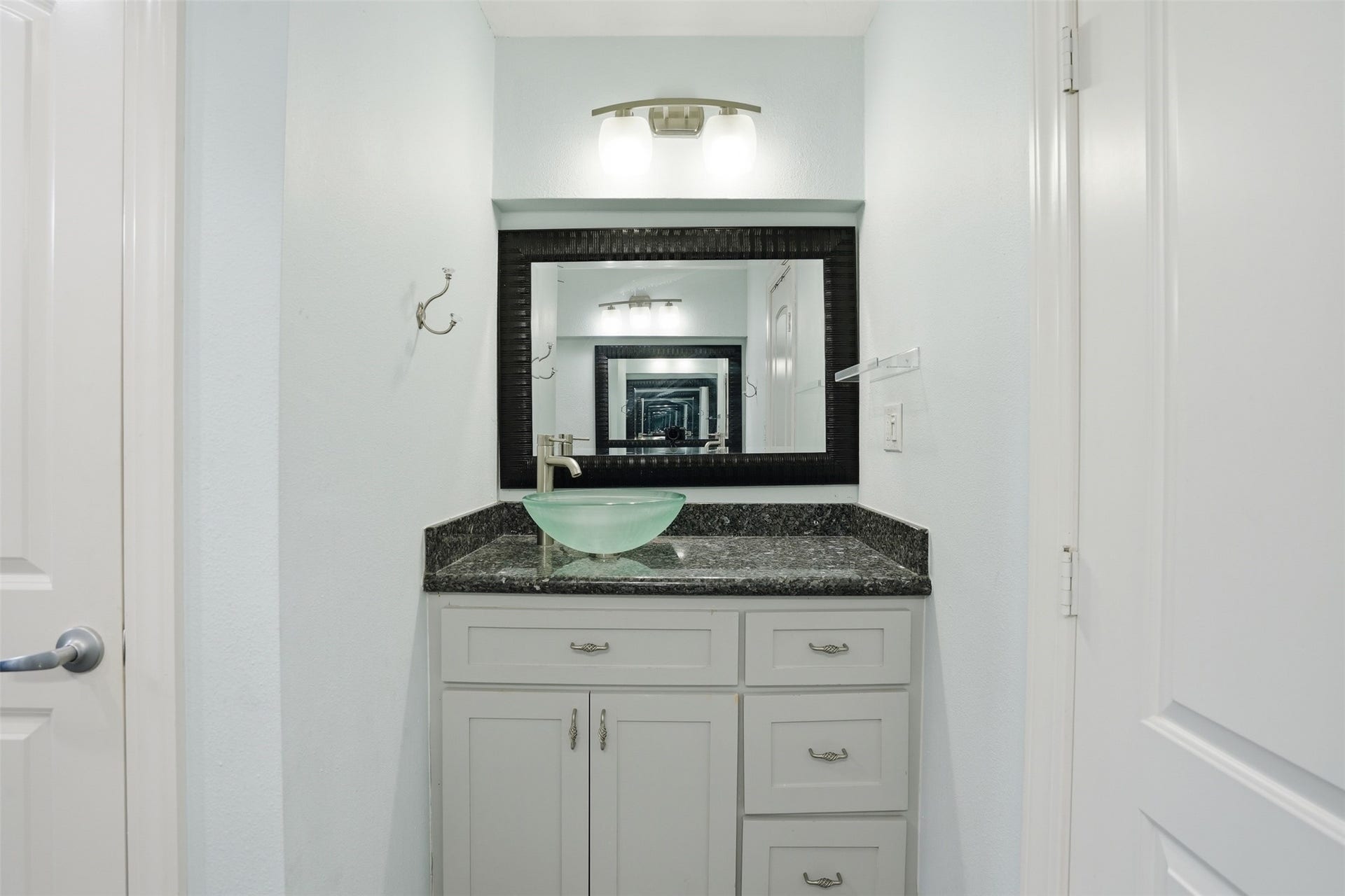 18024 Starboard Drive, Houston, TX 77058 Primary bath vanity area features granite countertops and two separate vanity spaces for added convenience.