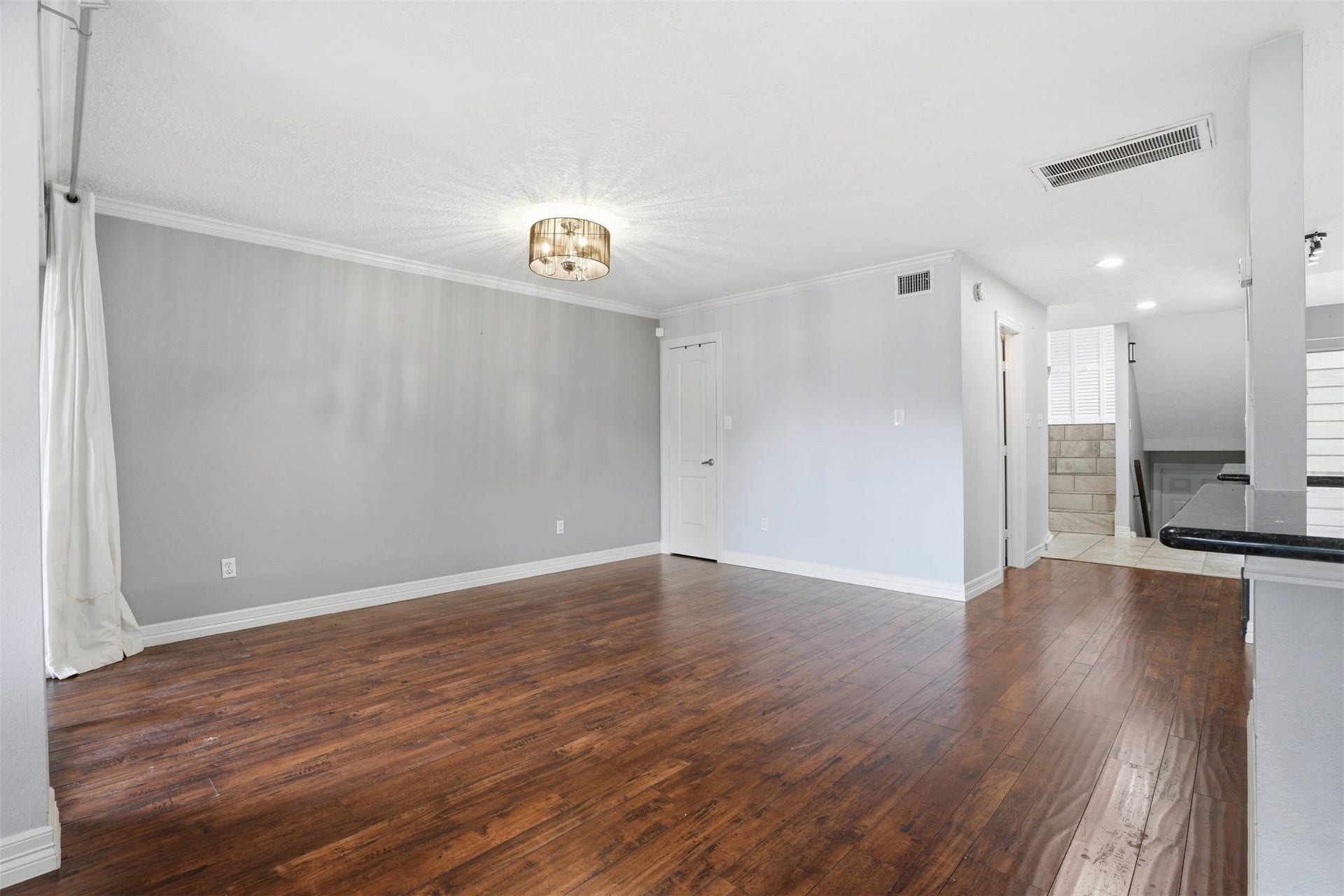 18024 Starboard Drive, Houston, TX 77058 Bright and spacious dining area with hardwood floors and an open layout that connects seamlessly to the kitchen and living spaces, creating a warm and welcoming atmosphere.