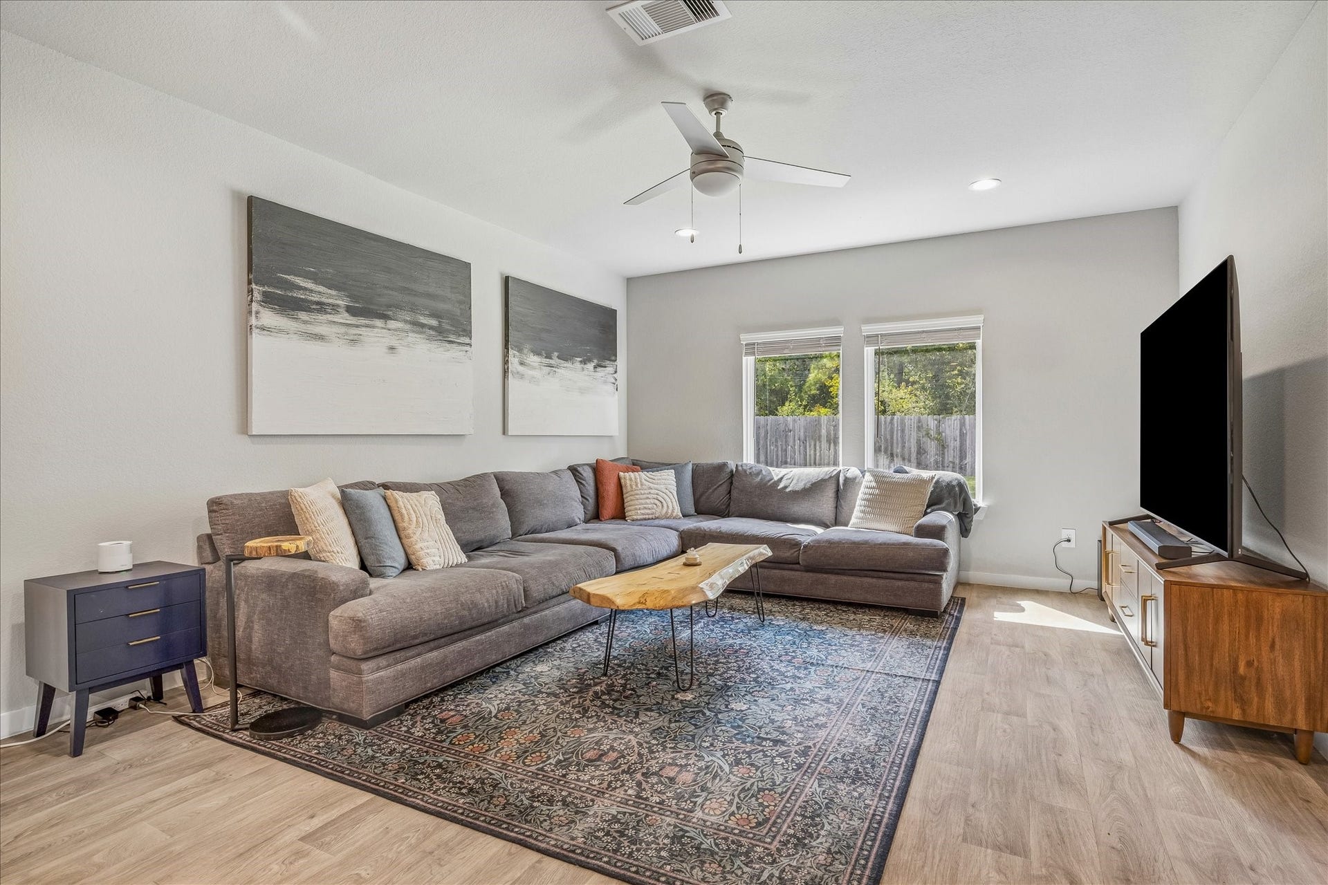 14249 Wonder Lake Lane, Conroe, TX 77384 The family room is open and bright. Wonderful view of the backyard and those beautiful trees!