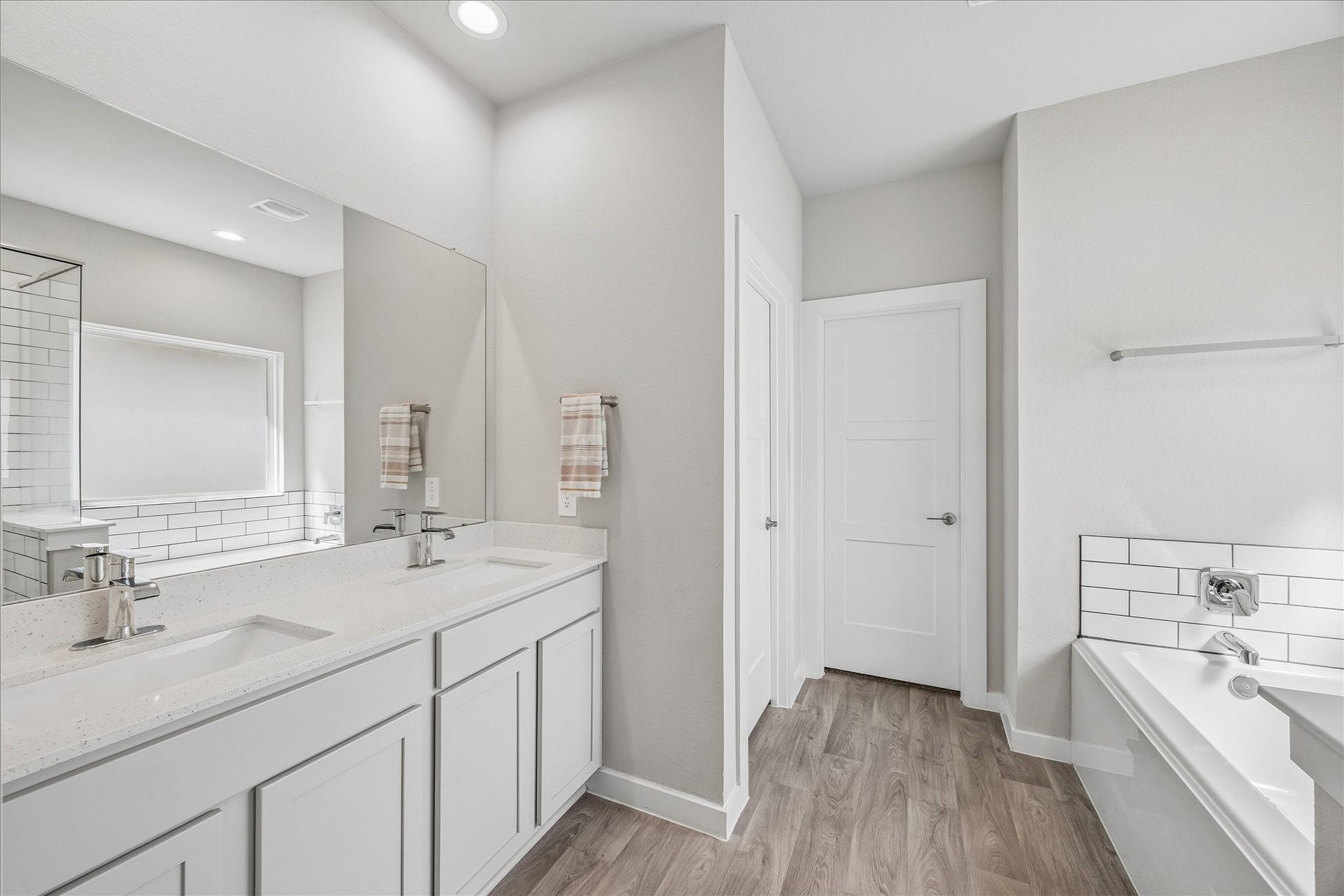 14249 Wonder Lake Lane, Conroe, TX 77384 Move in ready! Make this your personal retreat. Solid surface counters, designer tile tub surround, vinyl plank flooring.