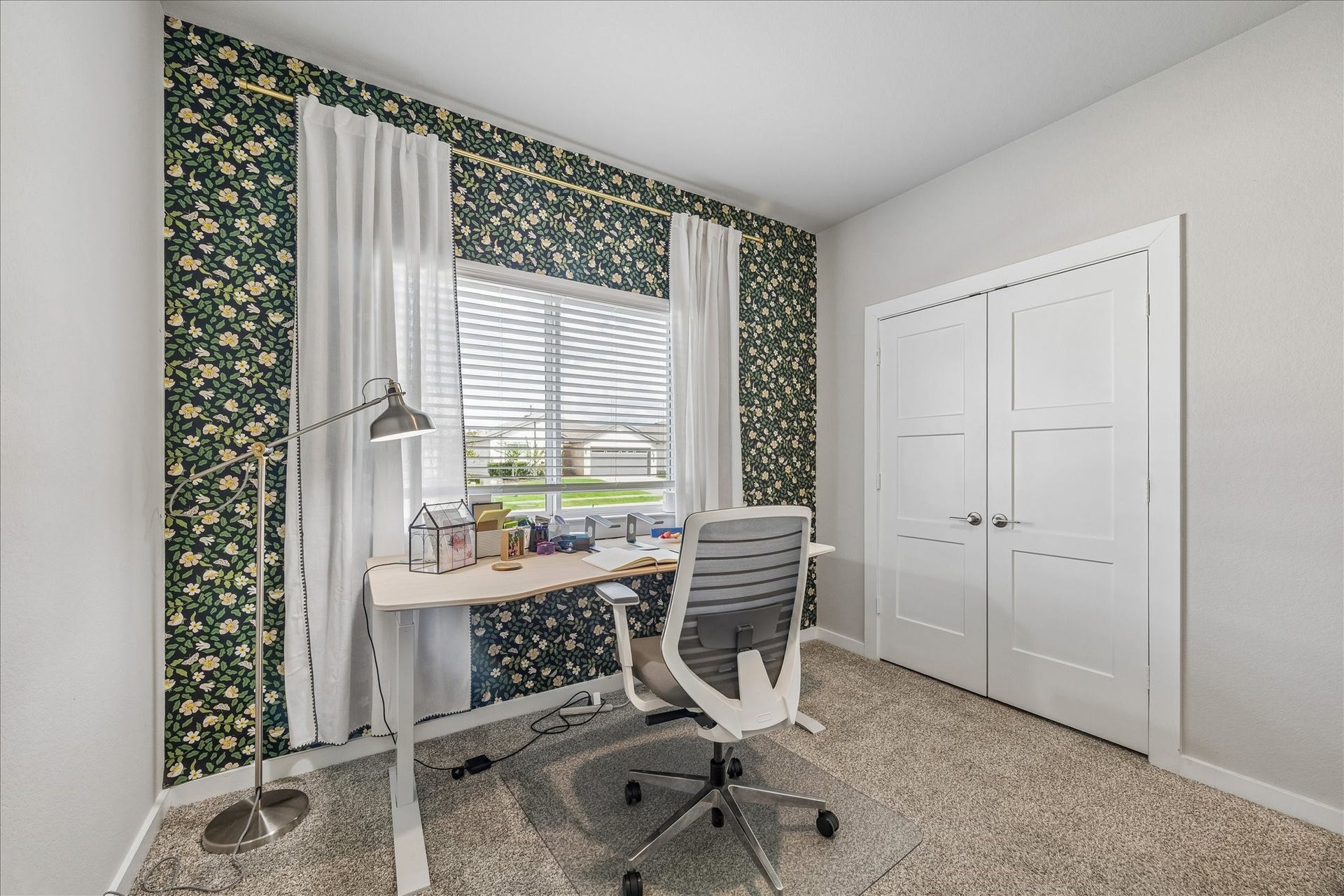 14249 Wonder Lake Lane, Conroe, TX 77384 Second bedroom downstairs. Currently used as a home office. Designer wall paper accents.