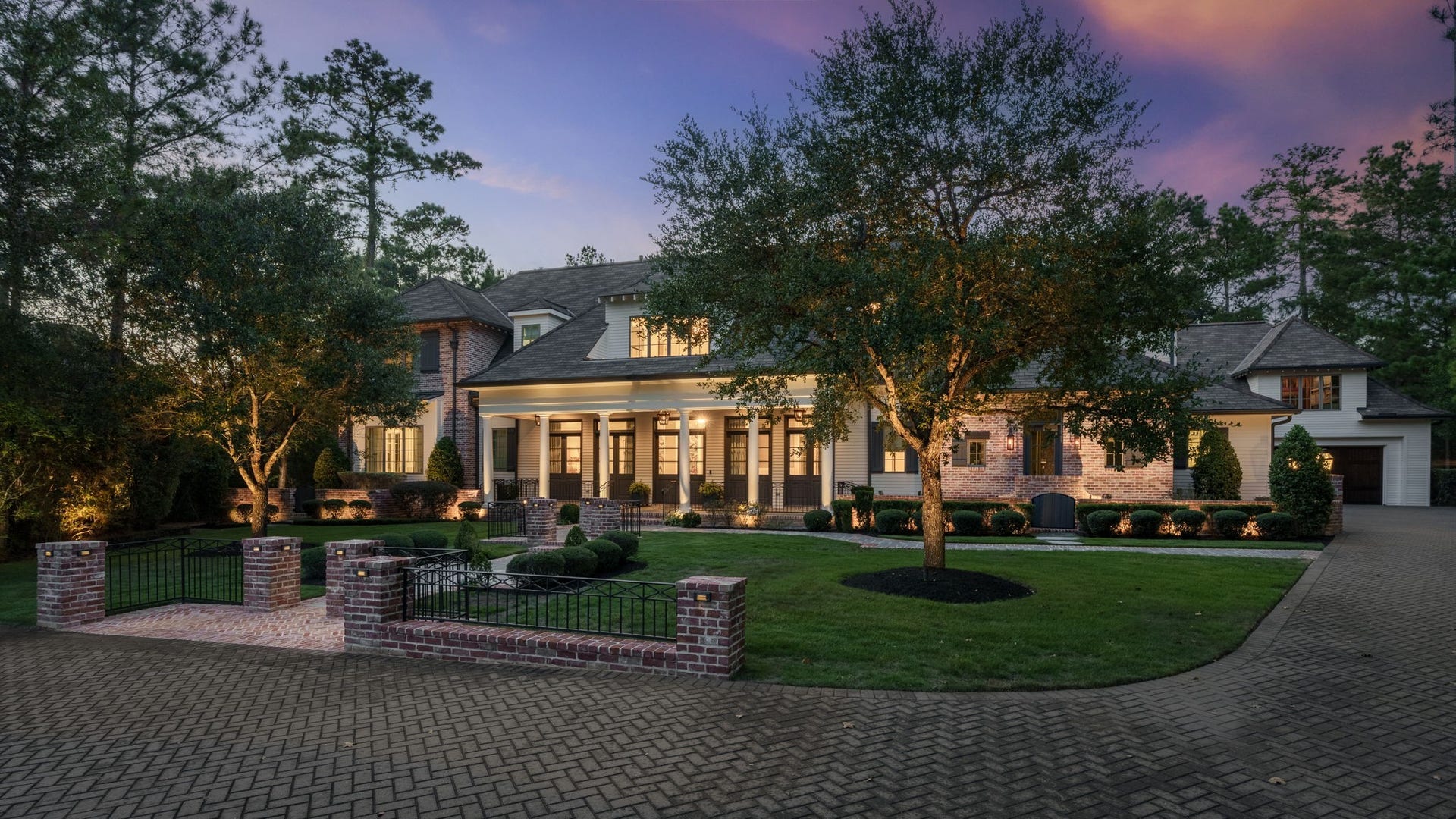 14 Peony Springs Court, The Woodlands, TX 77382 Underground gutter drainage system routed to the street. Two oversized carriage-style garages (one attached, one detached). A surprise garage opens to the backyard making yardwork simple. Above the detached garages is a second floor equipped with direct access to electrical and plumbing to convert the already framed-in room for an additional bedroom and en-suite if desired.