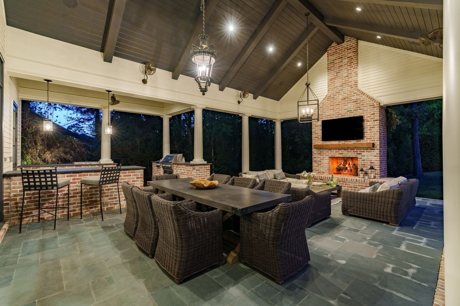 14 Peony Springs Court, The Woodlands, TX 77382 Ambiance galore! Outdoor entertaining features a massive, covered veranda with slate floor, fireplace underneath a finished wood vaulted ceiling.