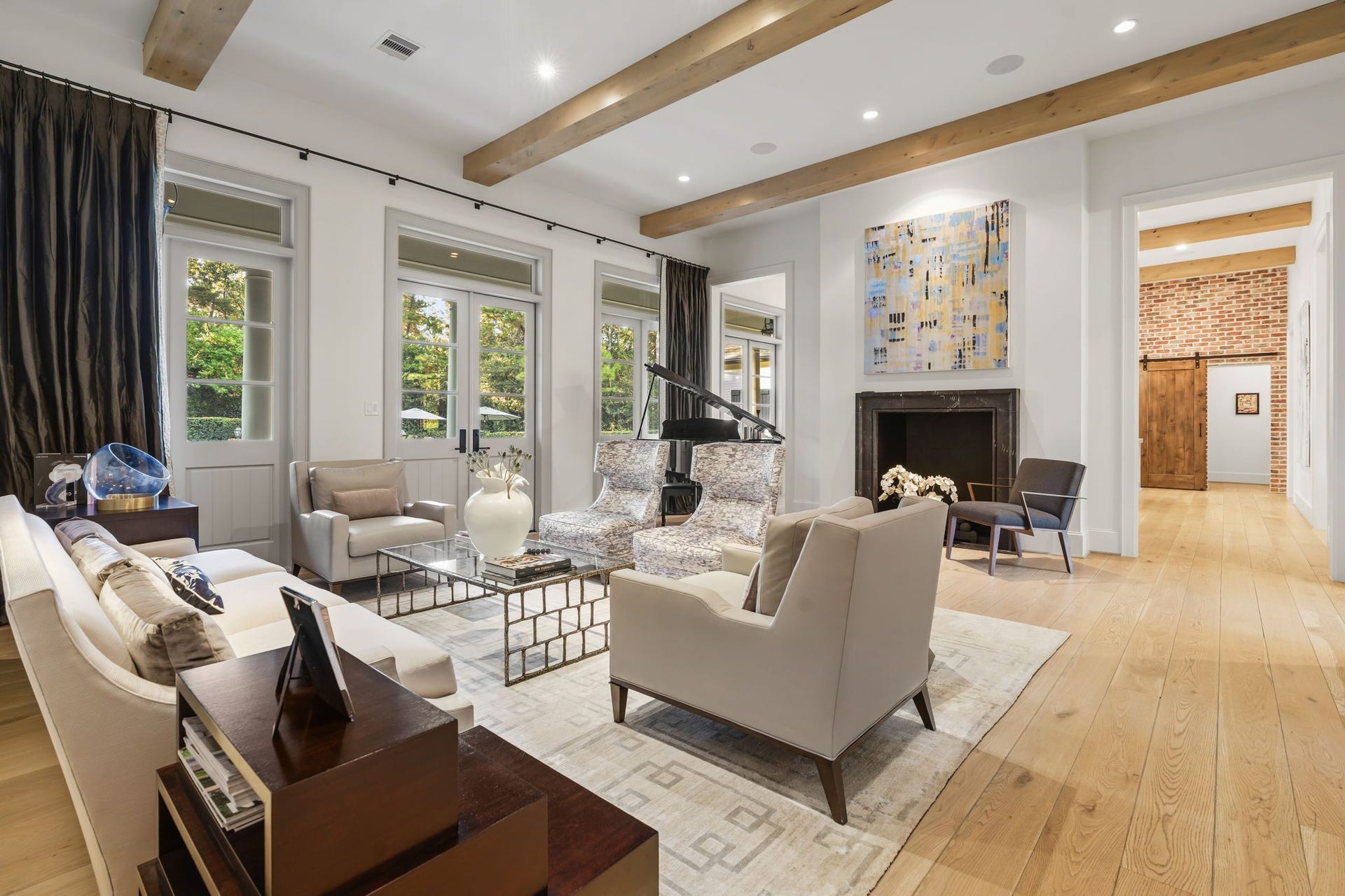 14 Peony Springs Court, The Woodlands, TX 77382 Enjoy beautiful hardwood floors, extensive custom woodwork, wood beams, paneling; designer drapery and wallpaper throughout.