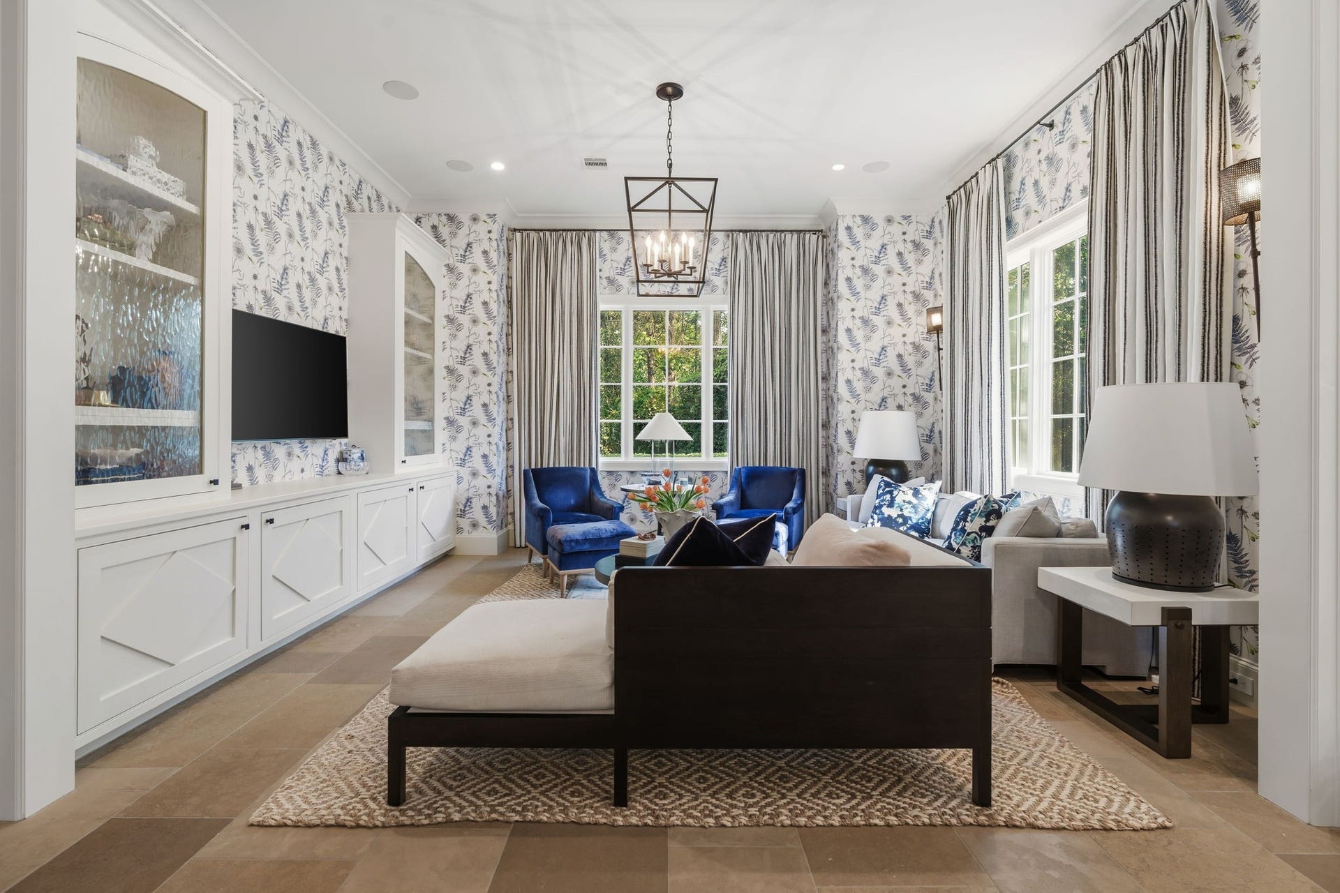 14 Peony Springs Court, The Woodlands, TX 77382 Enjoy one of the home's eight large flat-screen TV's! All eight TVs, sound, and lighting throughout the entire downstairs and main upper spaces are centrally located and controlled via a phone app.