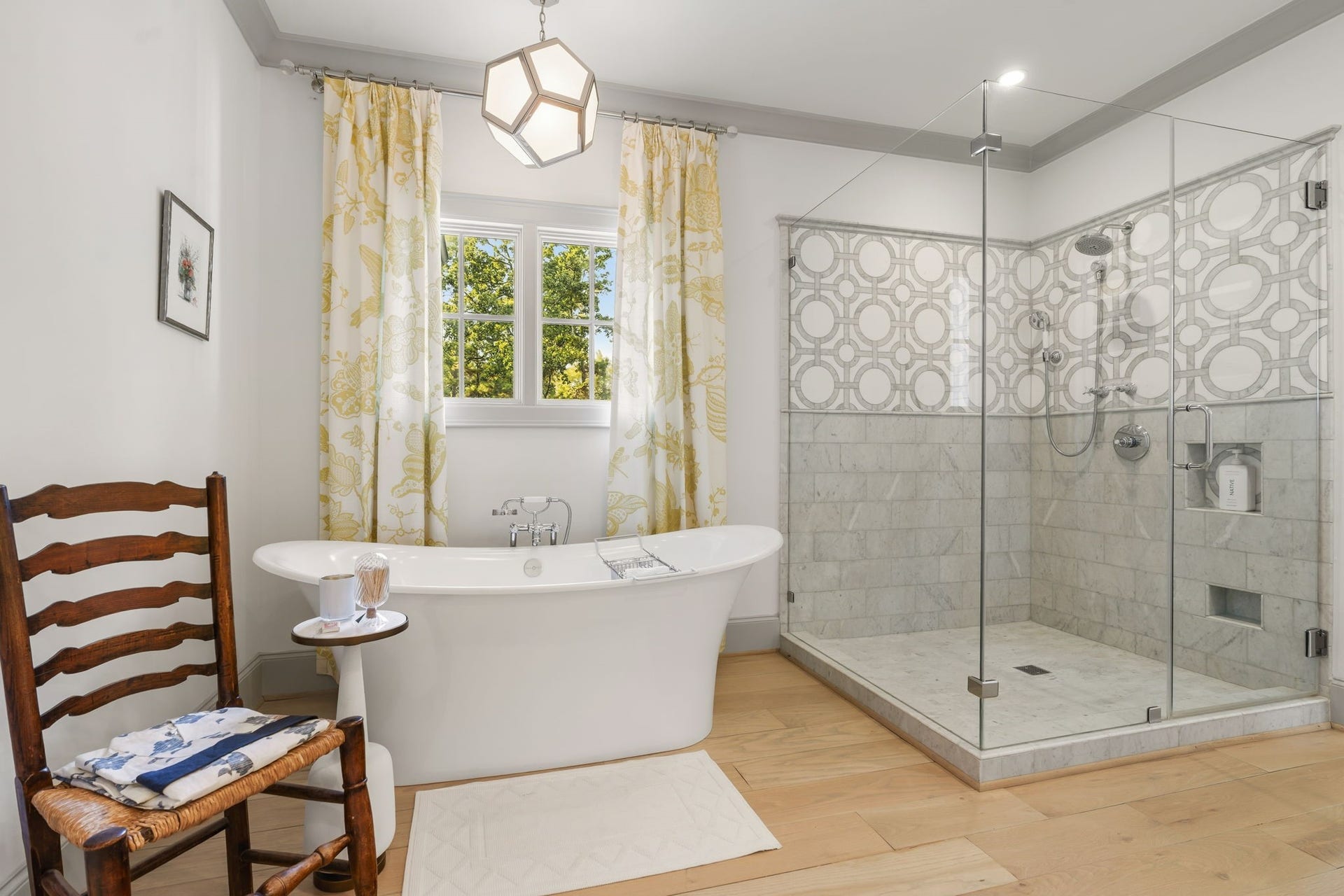 14 Peony Springs Court, The Woodlands, TX 77382 Features include a freestanding soaking tub and an oversized frameless glass shower with designer tile.
