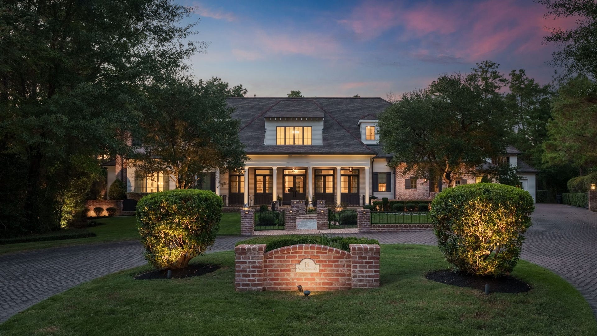 14 Peony Springs Court, The Woodlands, TX 77382 Paver driveway with electronic entry gate for added privacy.