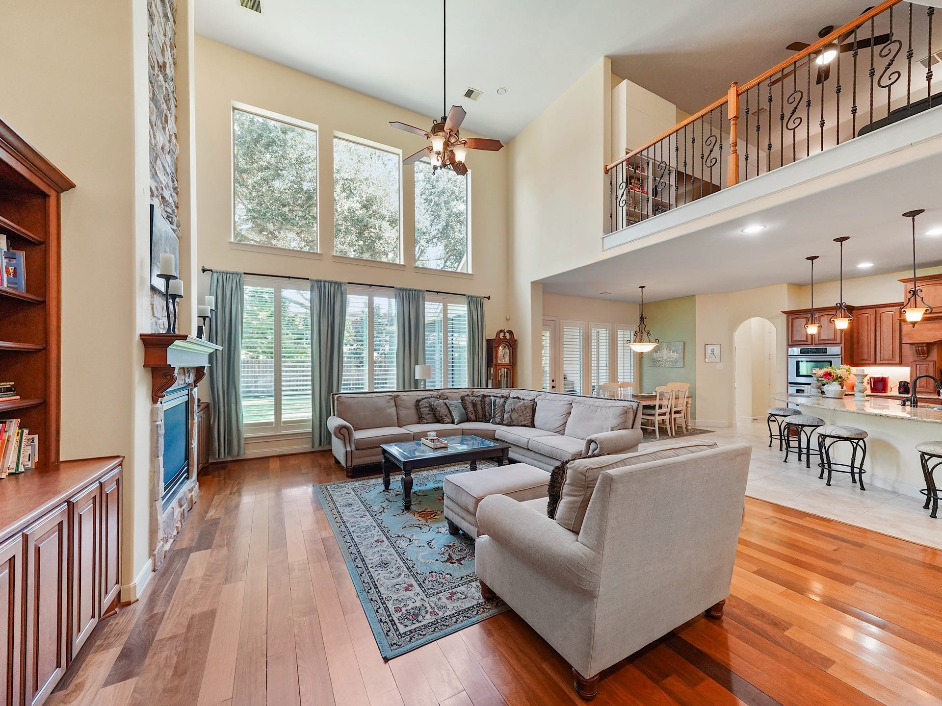 5907 Hawthorne Garden Way, Katy, TX 77494 Open sightlines between the family room and kitchen keep conversation flowing, whether hosting a crowd or settling in for a quiet evening at home.