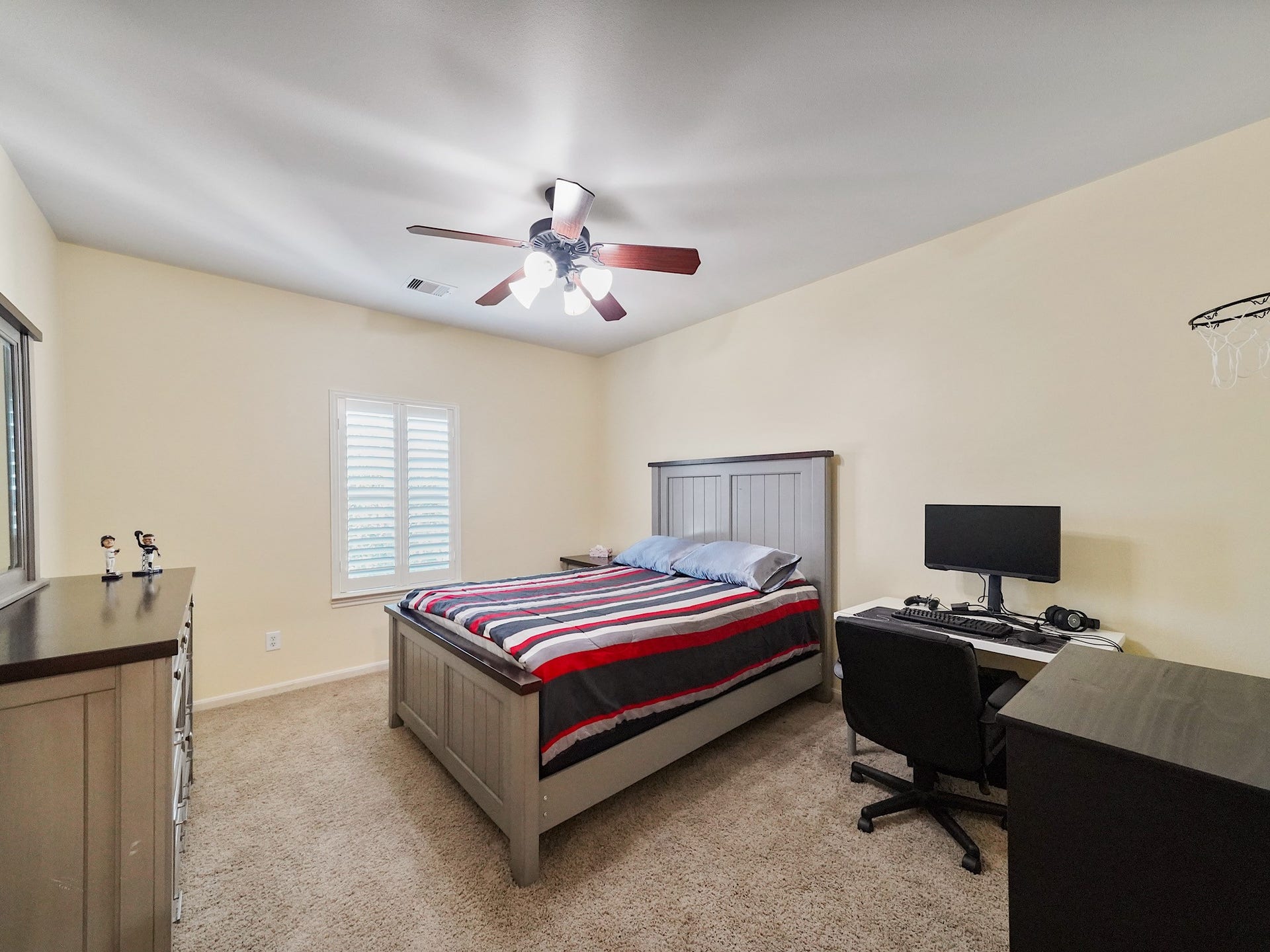 5907 Hawthorne Garden Way, Katy, TX 77494 Another secondary bedroom offers a bright, versatile space for family, guests, or a personalized hobby room.