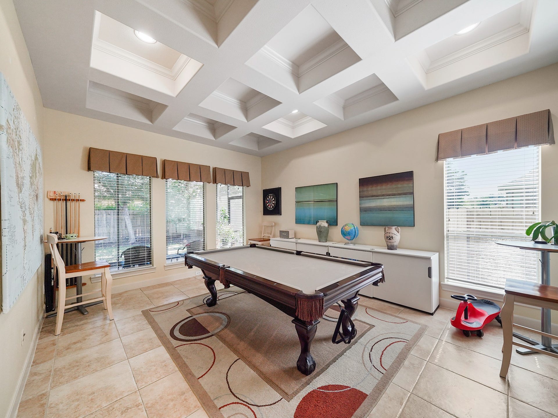 5907 Hawthorne Garden Way, Katy, TX 77494 The game rooms coffered ceiling and generous proportions create a fun, flexible extension of the main living areas.