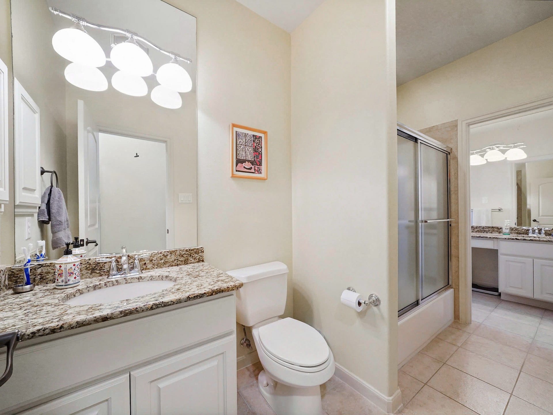 5907 Hawthorne Garden Way, Katy, TX 77494 A well-appointed full bath continues the homes consistent finishes with granite, ample vanity storage, and a shower enclosure.