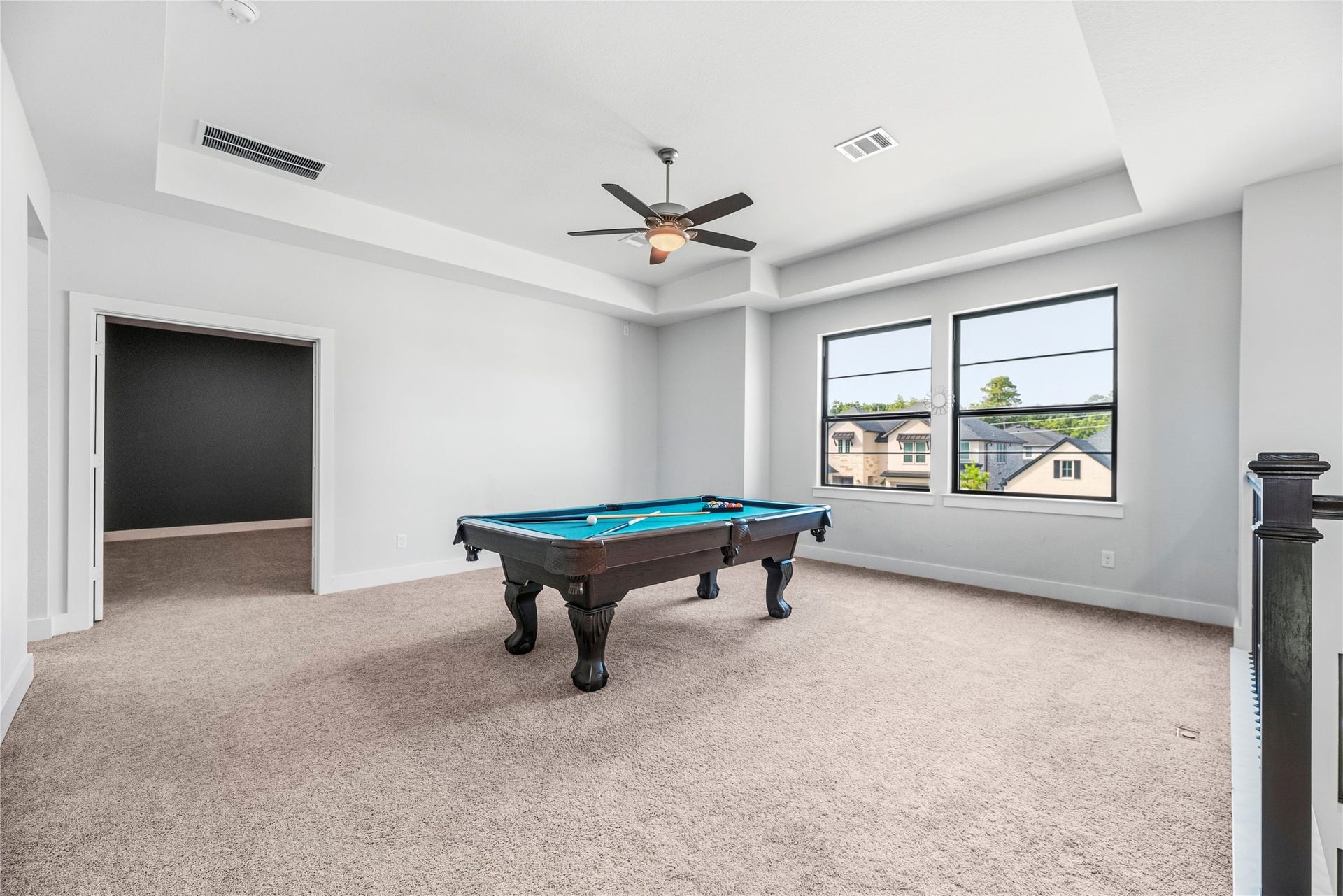 4810 Antler Run Drive, Spring, TX 77386 Spacious game room featuring a pool table, plush carpeting, and large windows offering ample natural light.