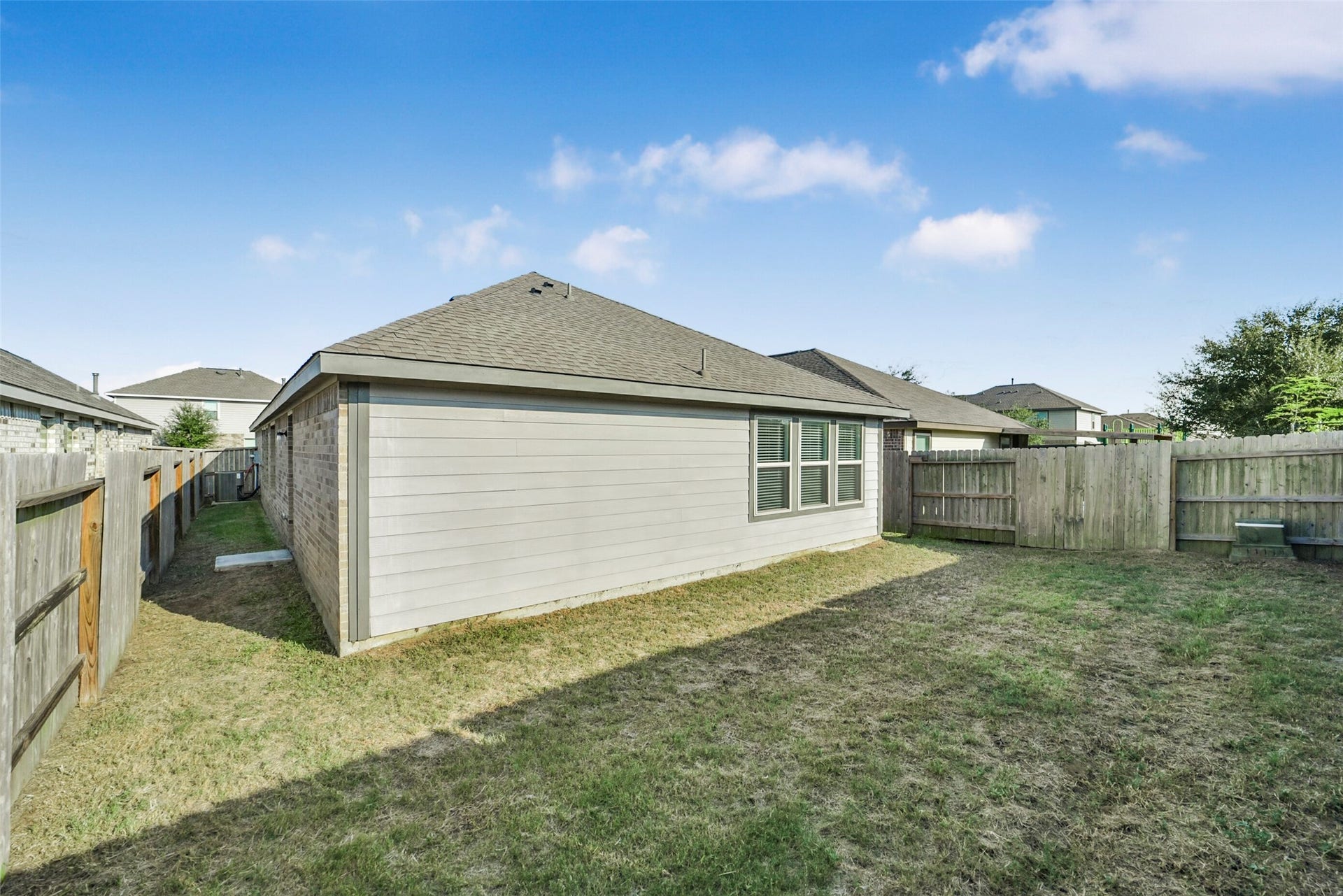 18511 Summit Ranch Drive, Hockley, TX 77447 Fully fenced back yard offers plenty of space for play