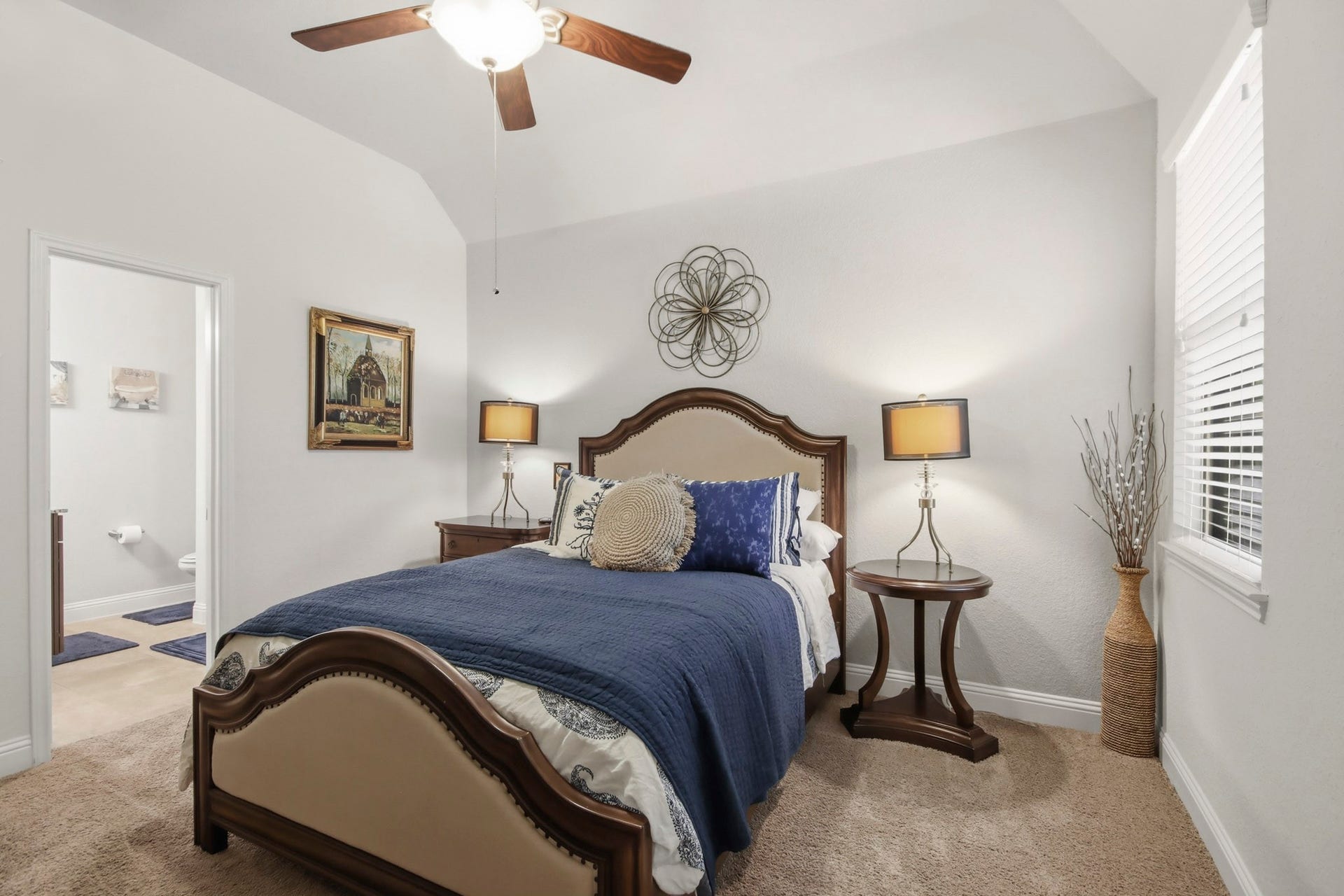 11 Whispering Thicket Place, The Woodlands, TX 77375 Cozy downstairs secondary bedroom featuring abundant natural light, a comfortable layout, and a welcoming atmosphere.