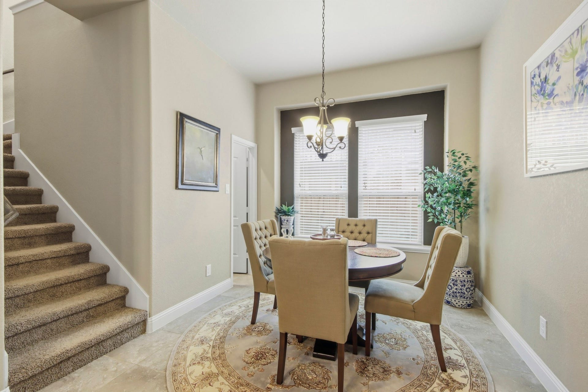 11 Whispering Thicket Place, The Woodlands, TX 77375 Charming breakfast area filled with abundant natural light. An incredible walk-in pantry is conveniently located just off the breakfast area, providing exceptional storage and organization.