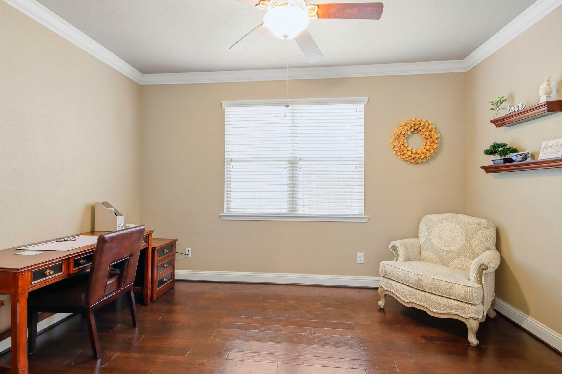 11 Whispering Thicket Place, The Woodlands, TX 77375 Bright and inviting home office featuring rich hardwood floors.