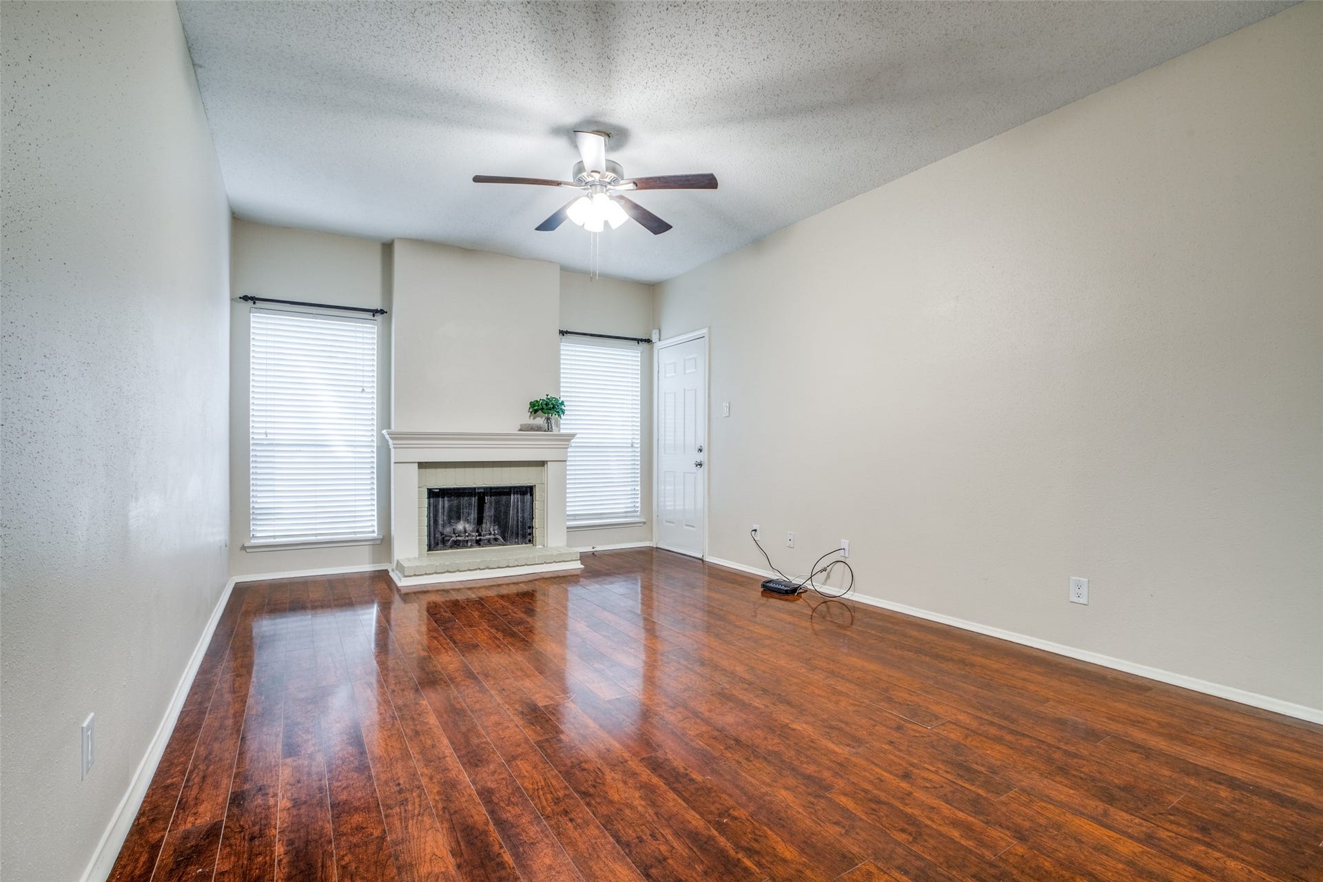 7900 N Stadium Drive, #93, Houston, TX 77030 Cozy wood burning fireplace with custom mantel. Here you see the door to access the private patio