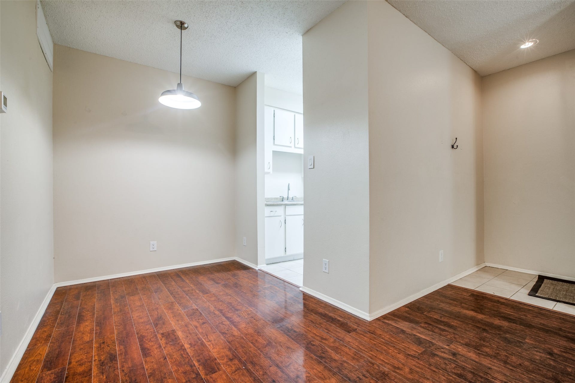 7900 N Stadium Drive, #93, Houston, TX 77030 View of dining/kitchen from bedroom hallway- the condo entry (tile) on the right
