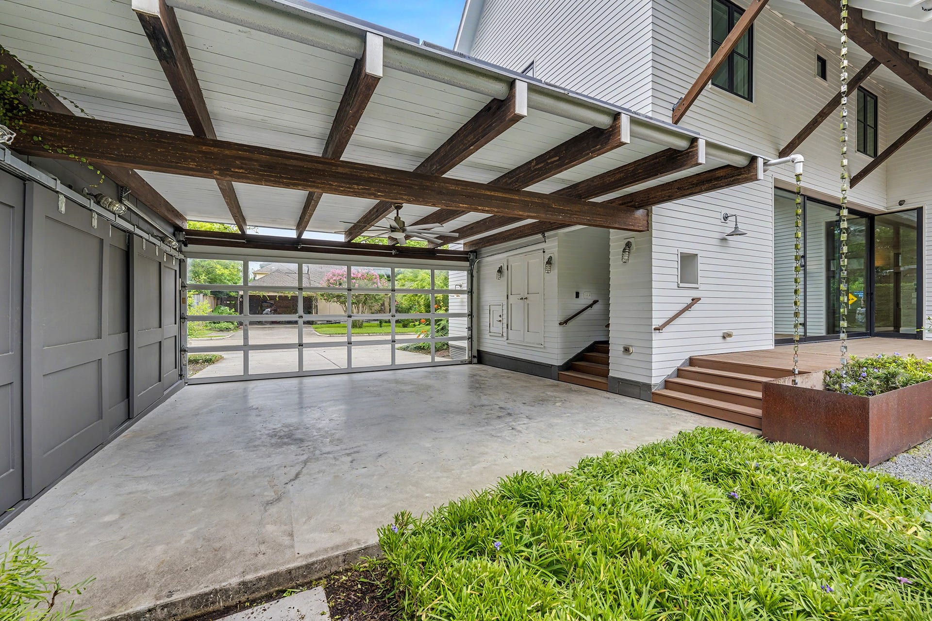 4153 Oberlin Street, West University Place, TX 77005 Garage has storage concealed behind sliding doors on the left and double doors on the right.