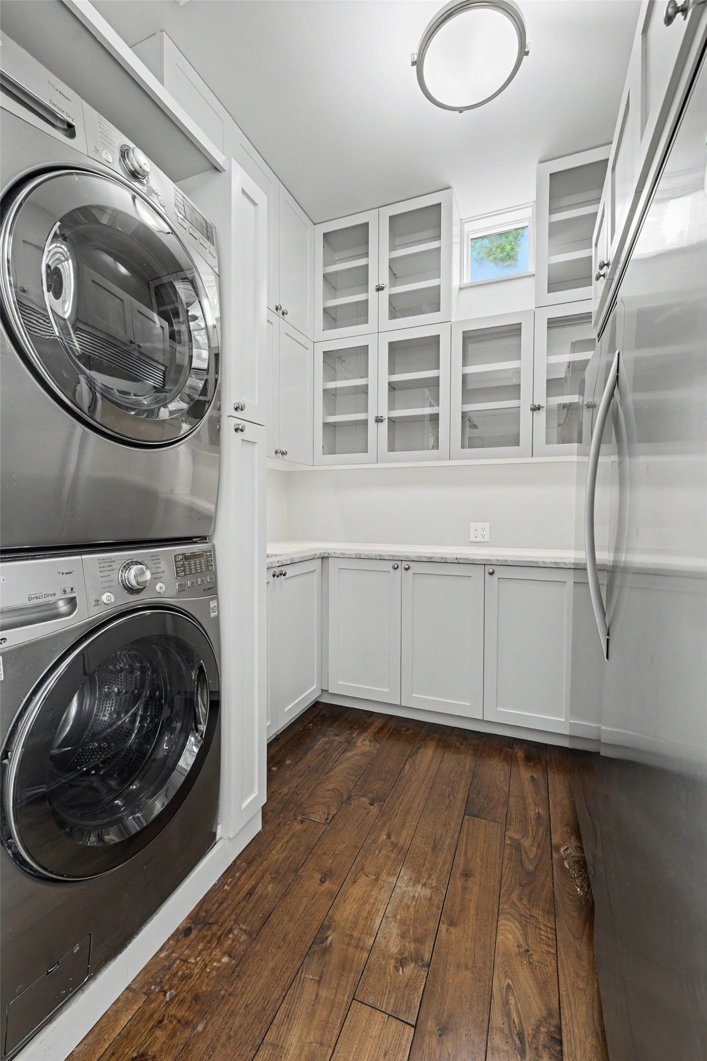 4153 Oberlin Street, West University Place, TX 77005 The spacious pantry is designed for convenience and efficiency, featuring a second sink, plentiful storage, full-size refrigerator and freezer, and a stacked washer and dryer.