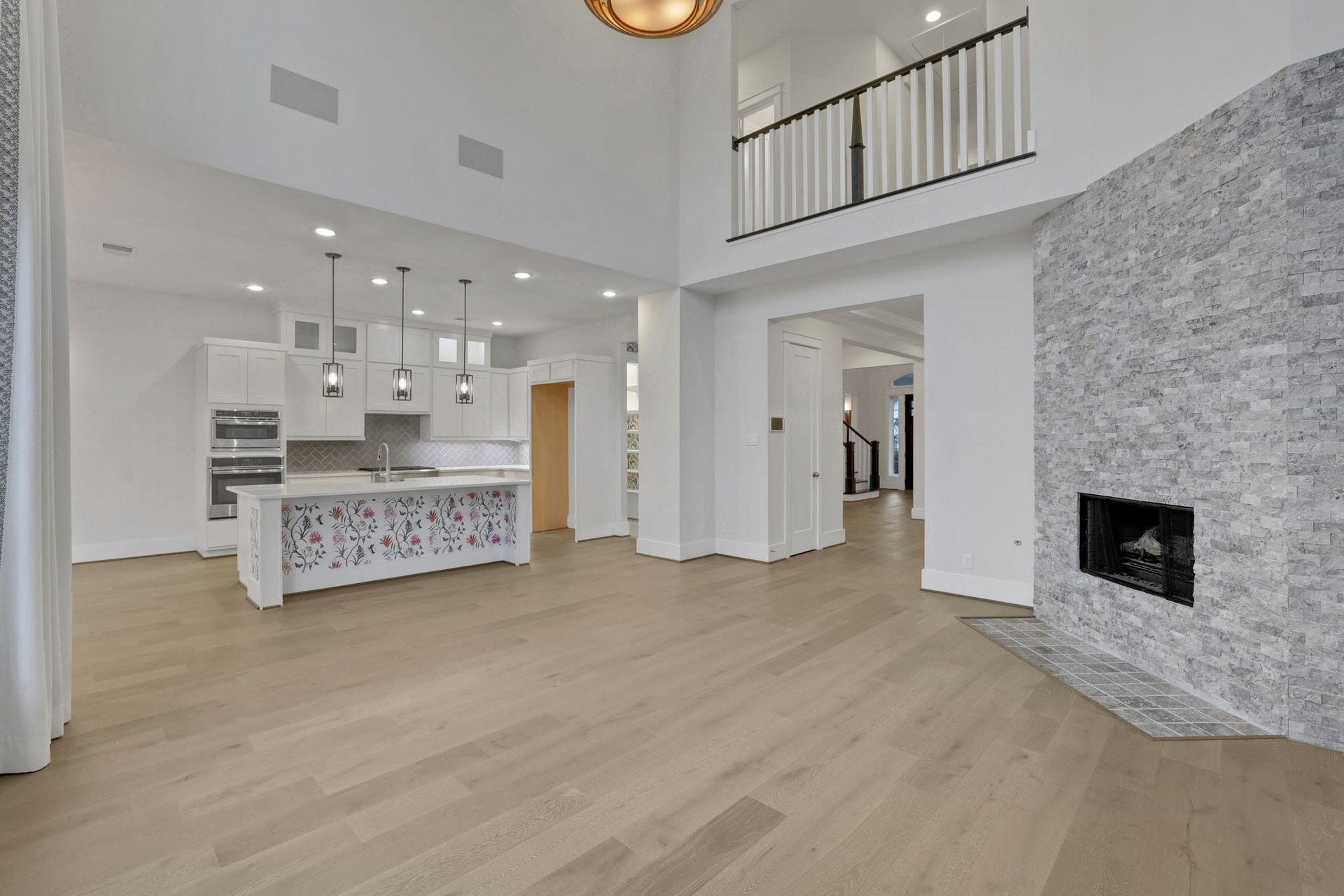 8558 Ridgepoint Drive, Houston, TX 77055 A fireplace and double height ceiling anchor the main living room.