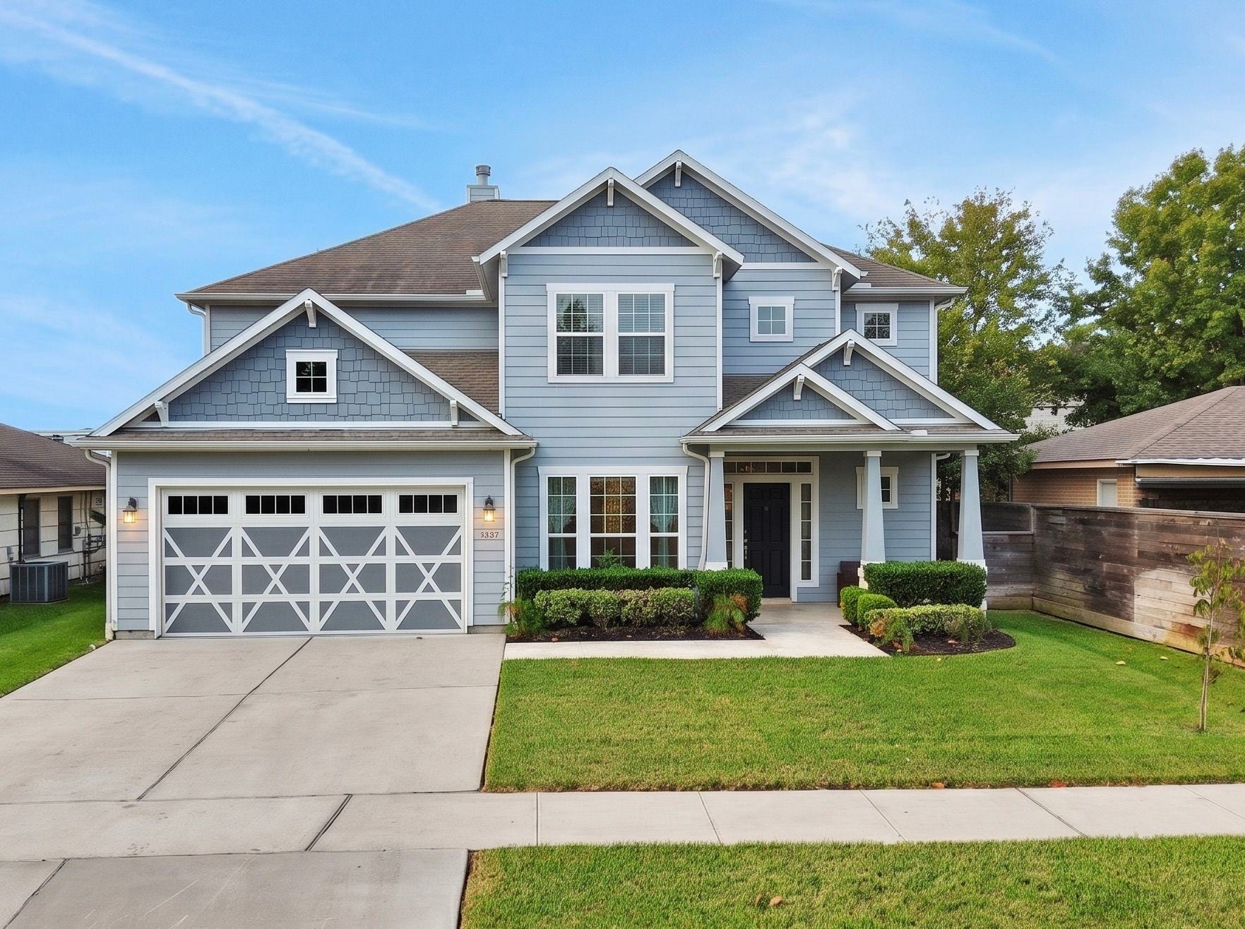8558 Ridgepoint Drive, Houston, TX 77055 Crisp trim and a carriage style garage door give the front its character.
