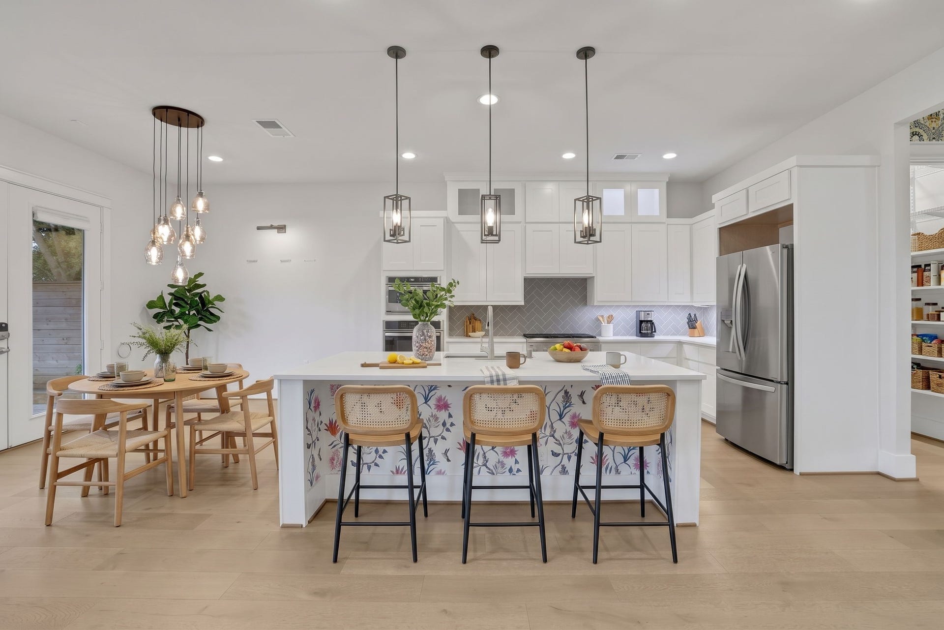 8558 Ridgepoint Drive, Houston, TX 77055 A wood island and counter seating make the kitchen the center of the home.