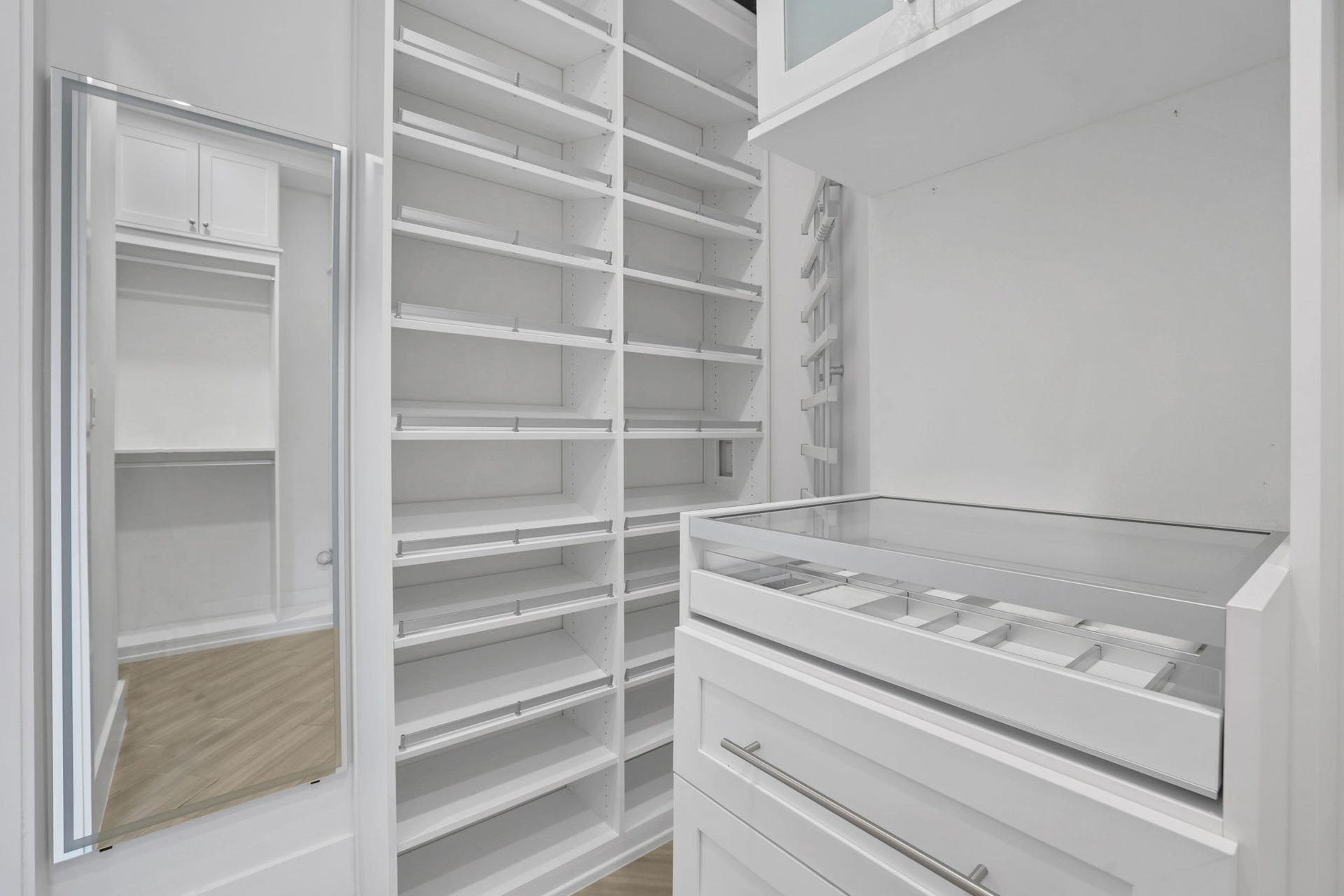 8558 Ridgepoint Drive, Houston, TX 77055 Built in shelving creates space for an organized wardrobe.